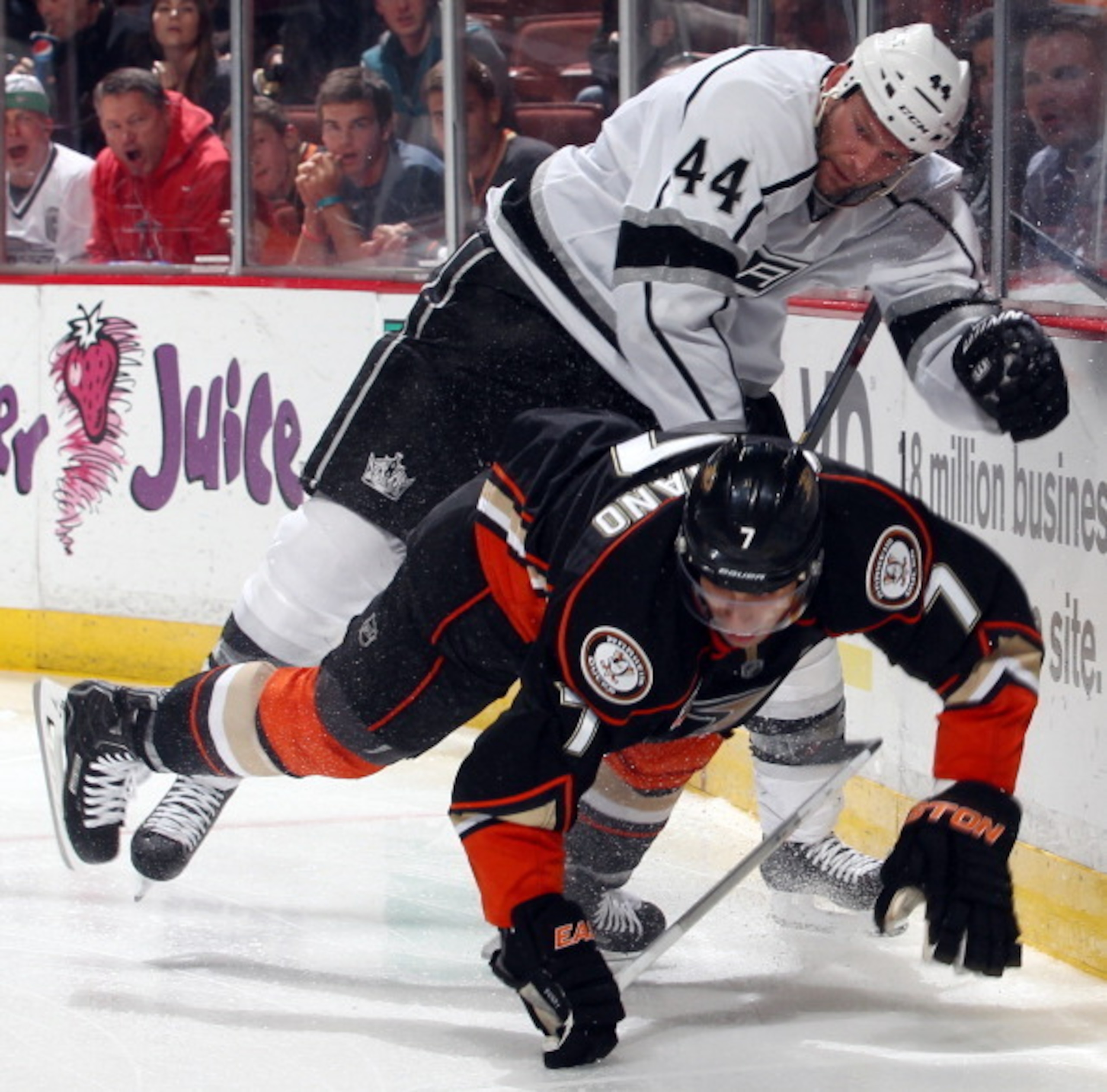 ANAHEIM, CA - JANUARY 23:  Robyn Regehr #44 of the Los Angeles Kings collides with Andrew Cogliano #7 of the Anaheim Ducks on January 23, 2014 at Honda Center in Anaheim, California. (Photo by Debora Robinson/NHLI via Getty Images)