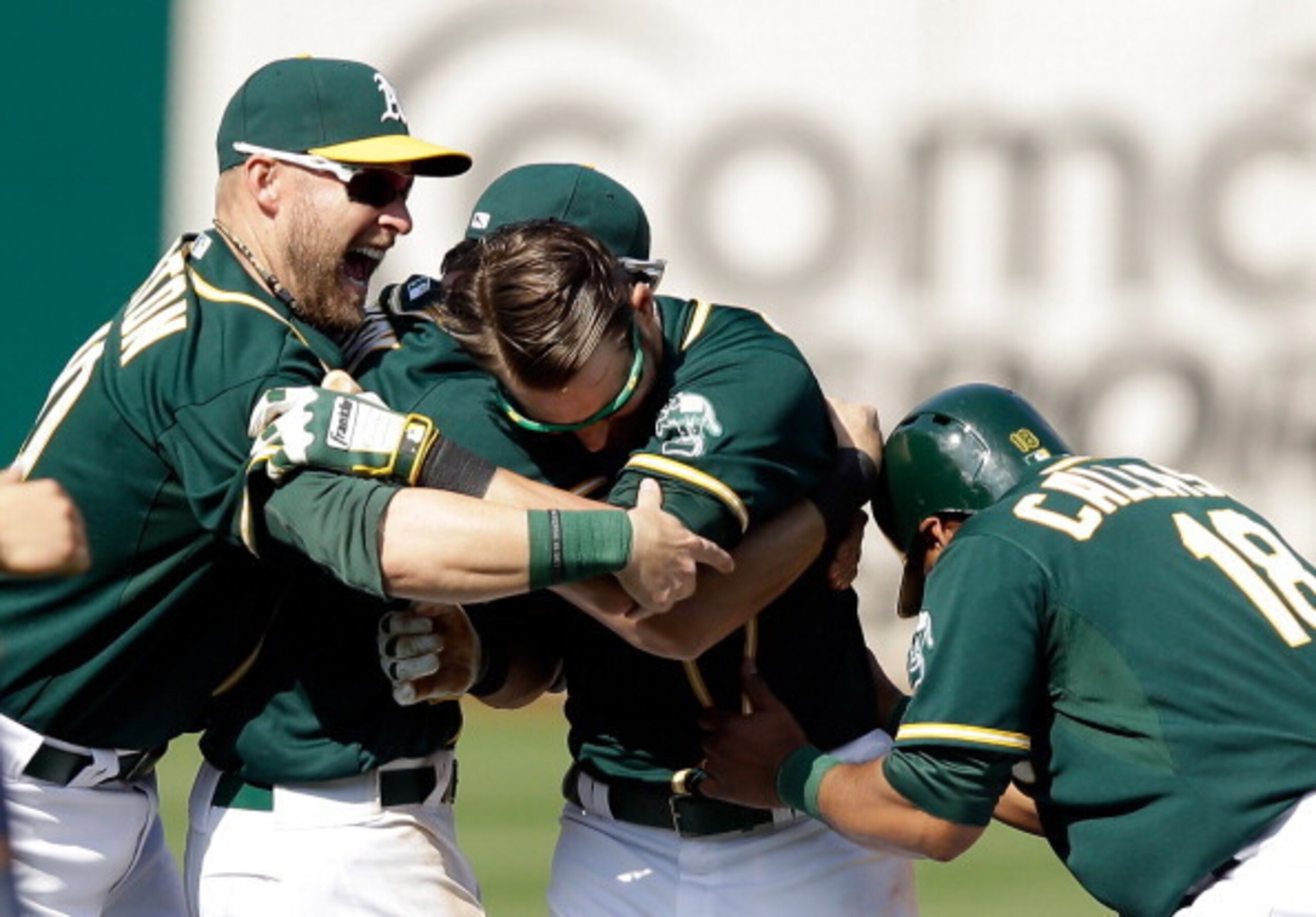 It looks like an awesome bromance, but it's just another A's walk-off.