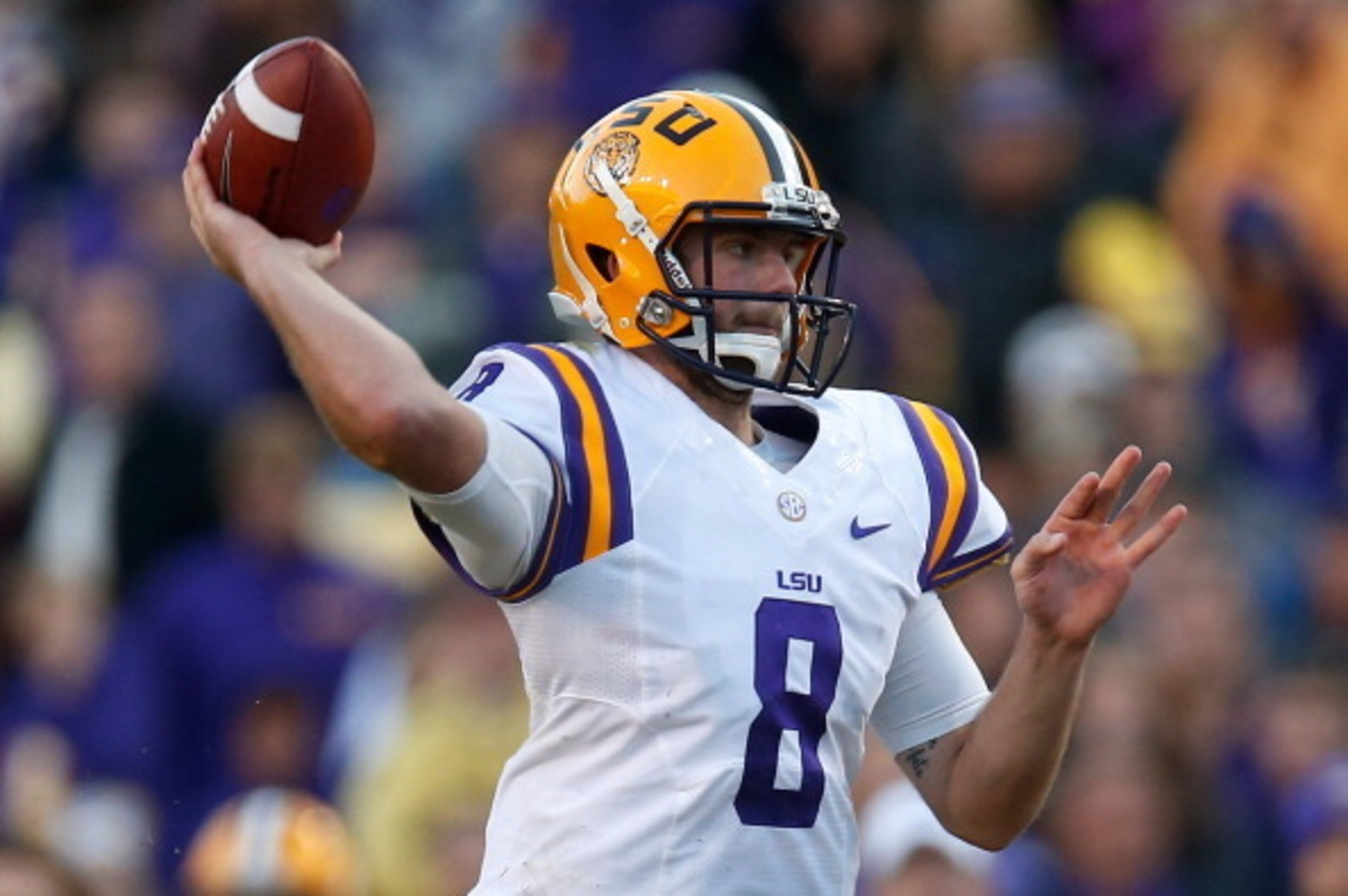 BATON ROUGE, LA - NOVEMBER 29:  Quarterback Zach Mettenberger #8 of the LSU Tigers throws a a pass against the Arkansas Razorbacks at Tiger Stadium on November 29, 2013 in Baton Rouge, Louisiana.  (Photo by Chris Graythen/Getty Images)