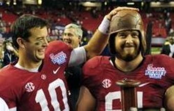 Guard Anthony Steen wears a trophy from last year's Chick-fil-A Kickoff Game.