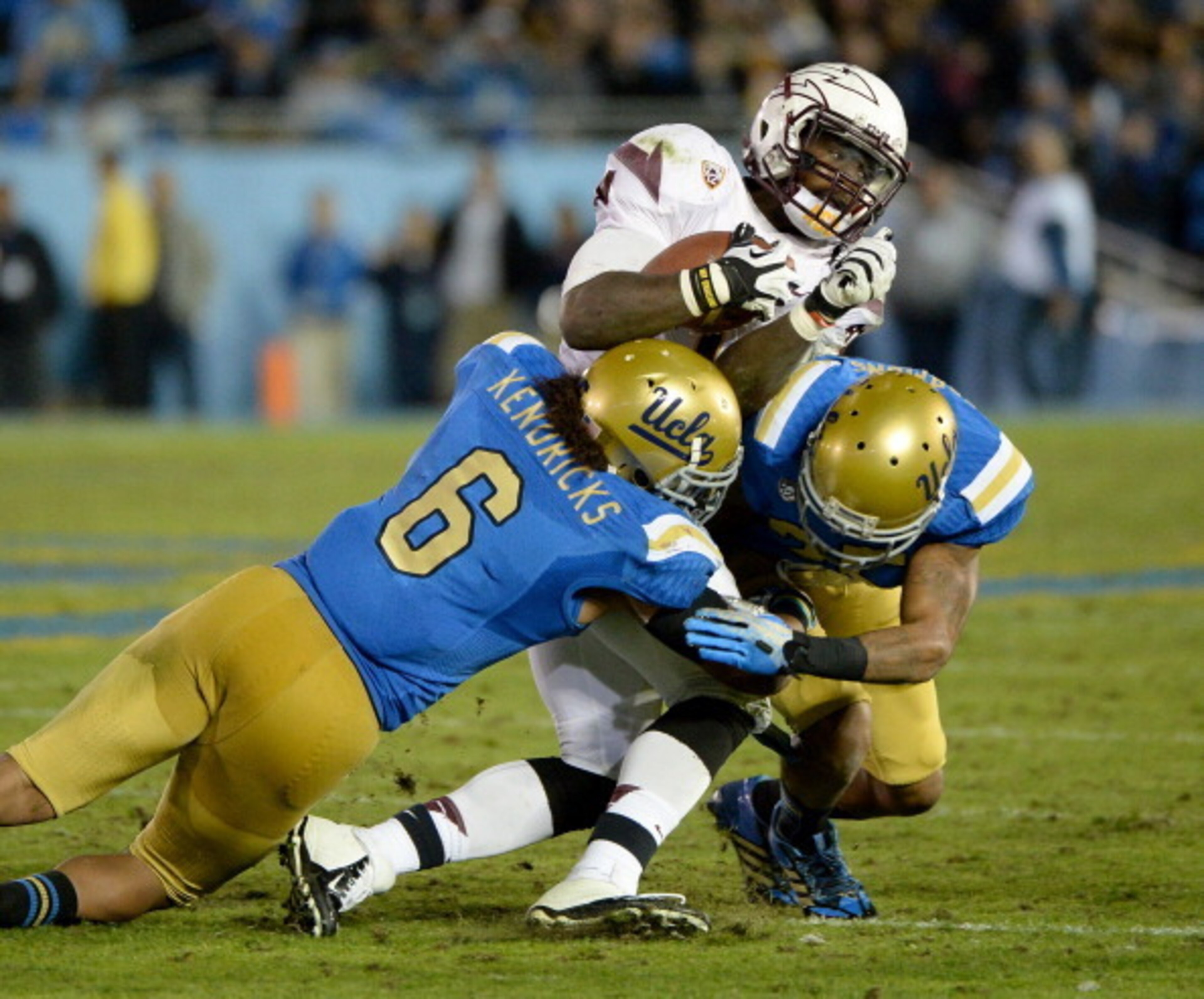 PASADENA, CA - NOVEMBER 23: Marion Grice #1 of the Arizona State Sun Devils is hit by Eric Kendricks #6 of the UCLA Bruins and Brandon Sermons #25 for a stop on third down during the third quarter at Rose Bowl on November 23, 2013 in Pasadena, California PASADENA, CA - NOVEMBER 23: Marion Grice #1 of the Arizona State Sun Devils is hit by Eric Kendricks #6 of the UCLA Bruins and Brandon Sermons #25 for a stop on third down during the third quarter at Rose Bowl on November 23, 2013 in Pasadena, California
