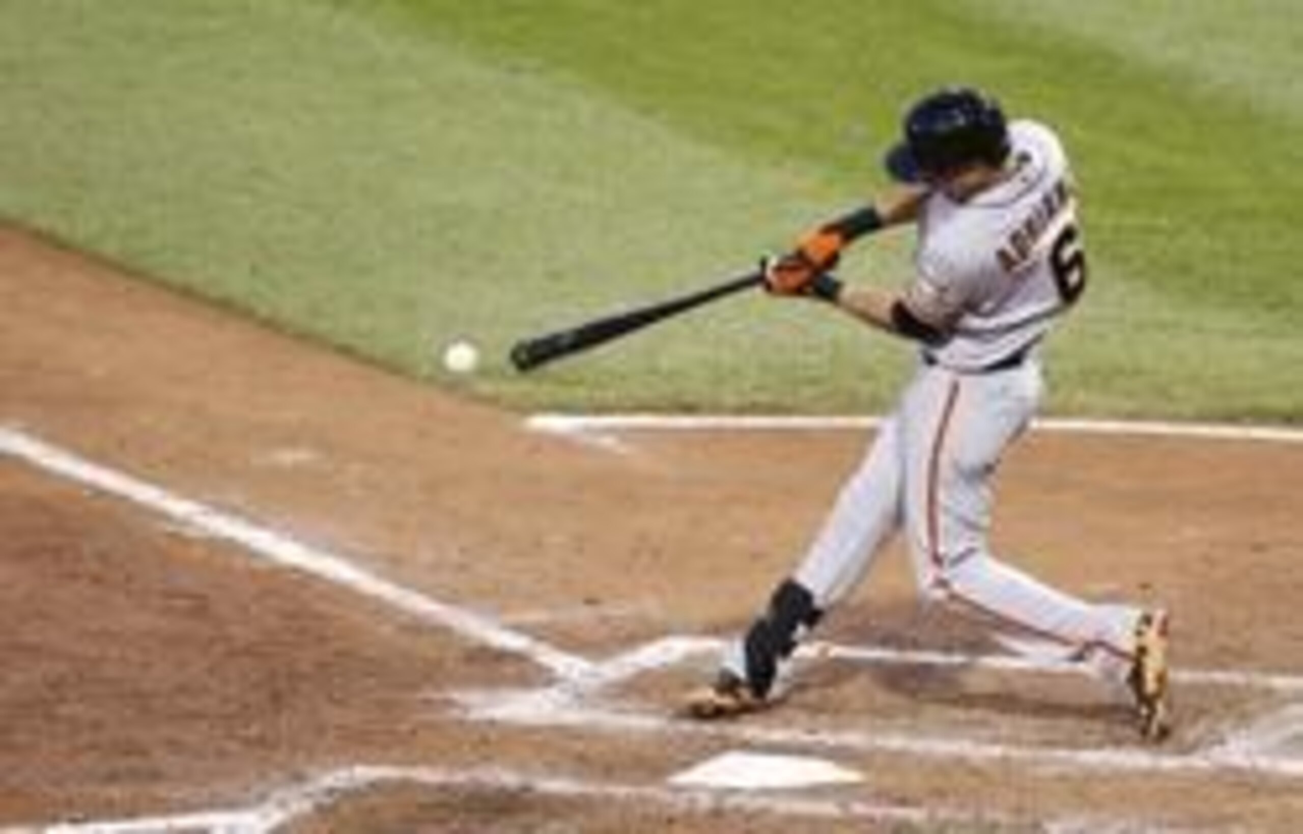 May 6, 2014; Pittsburgh, PA, USA; San Francisco Giants second baseman Ehire Adrianza (6) singles against the Pittsburgh Pirates during the fifth inning at PNC Park. The Pirates won 2-1. Mandatory Credit: Charles LeClaire-USA TODAY Sports