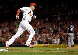 Allen Craig rounds third base after hitting a home run against the Brewers on April 24.