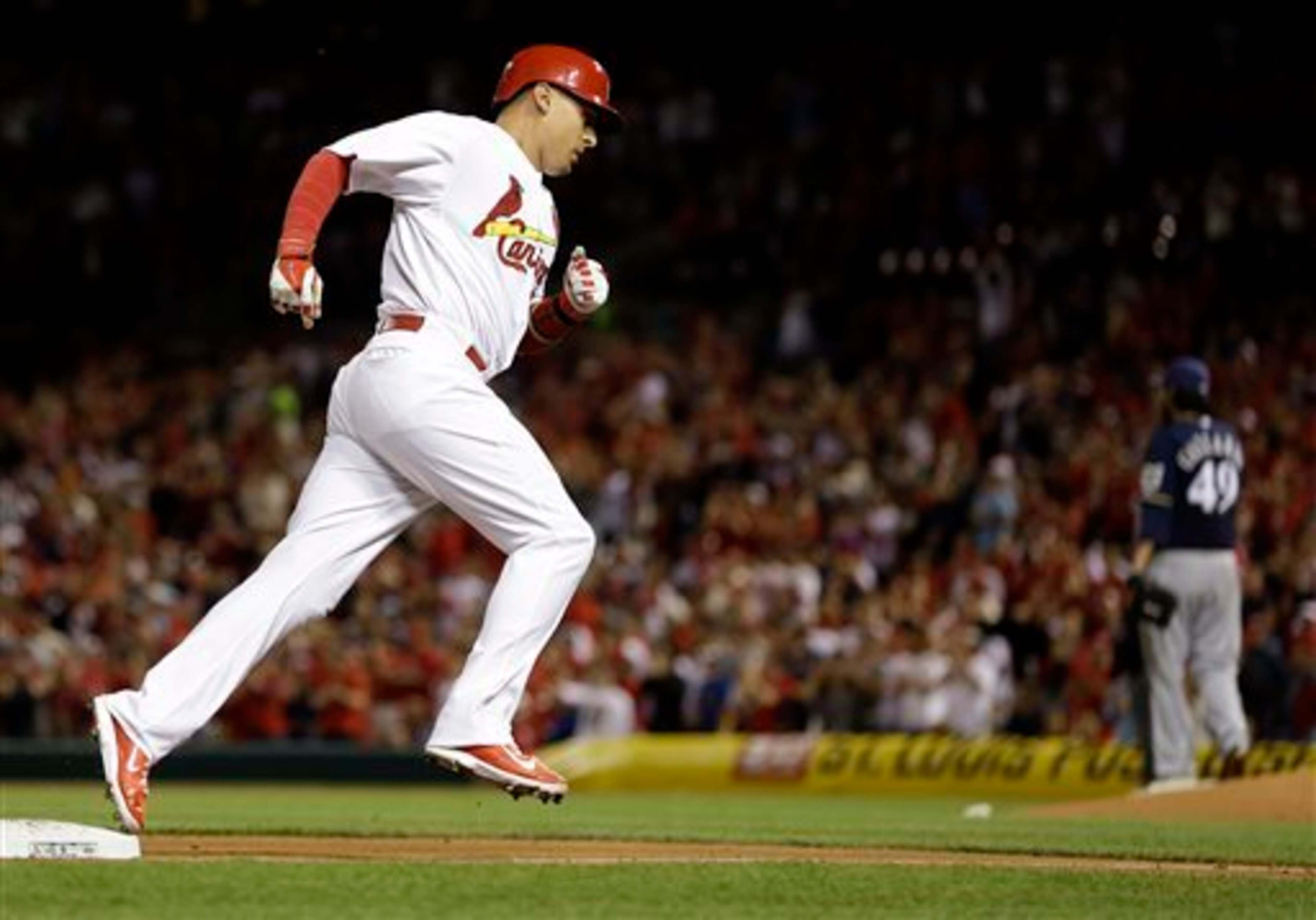 Allen Craig rounds third base after hitting a home run against the Brewers on April 24.
