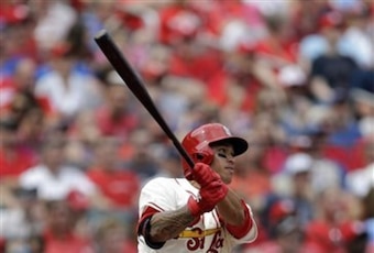 Kolten Wong gets a hit against the Cubs on April 12.