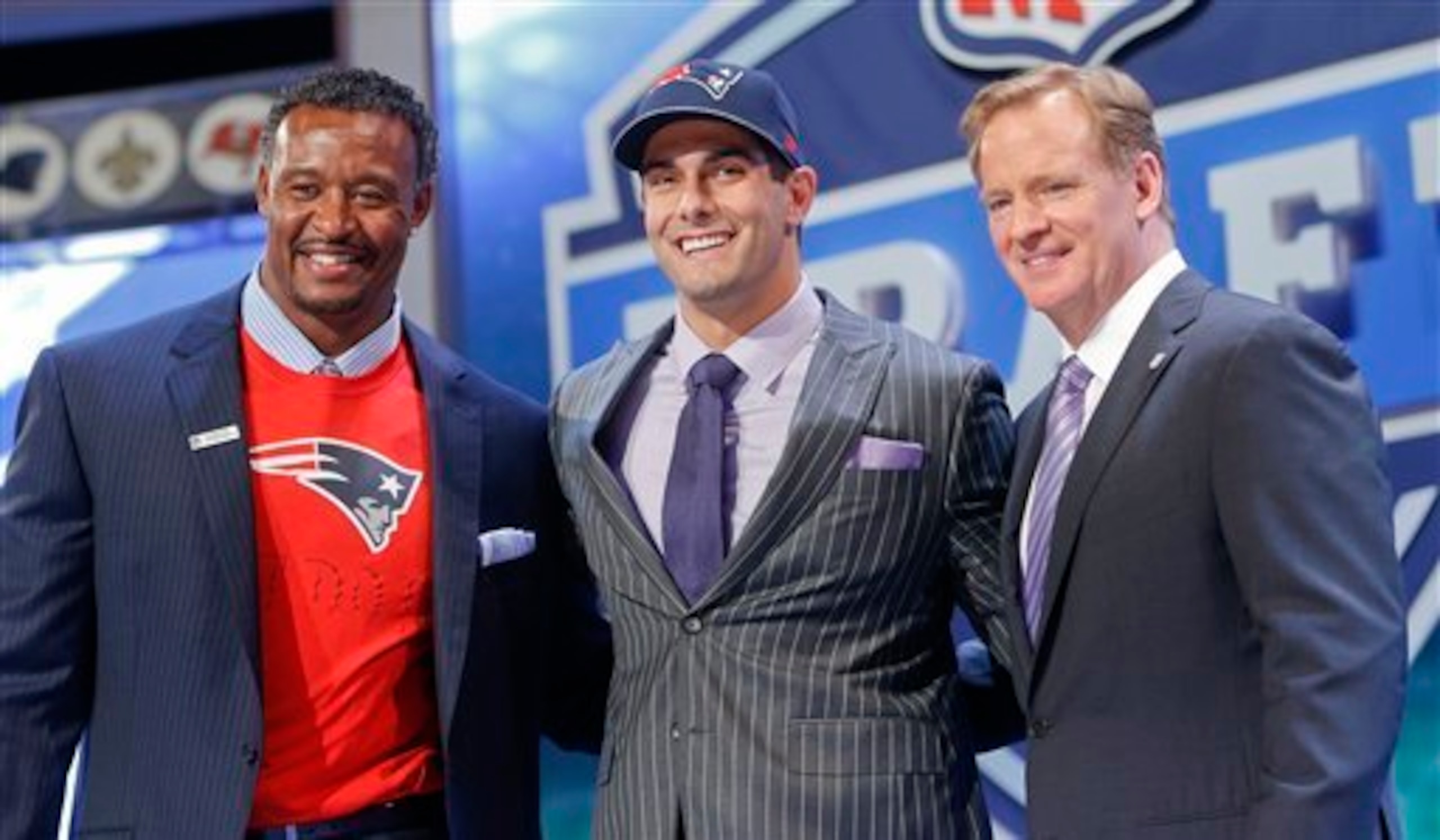The Patriots made Eastern Illinois QB Jimmy Garoppolo (middle) their second-round selection.