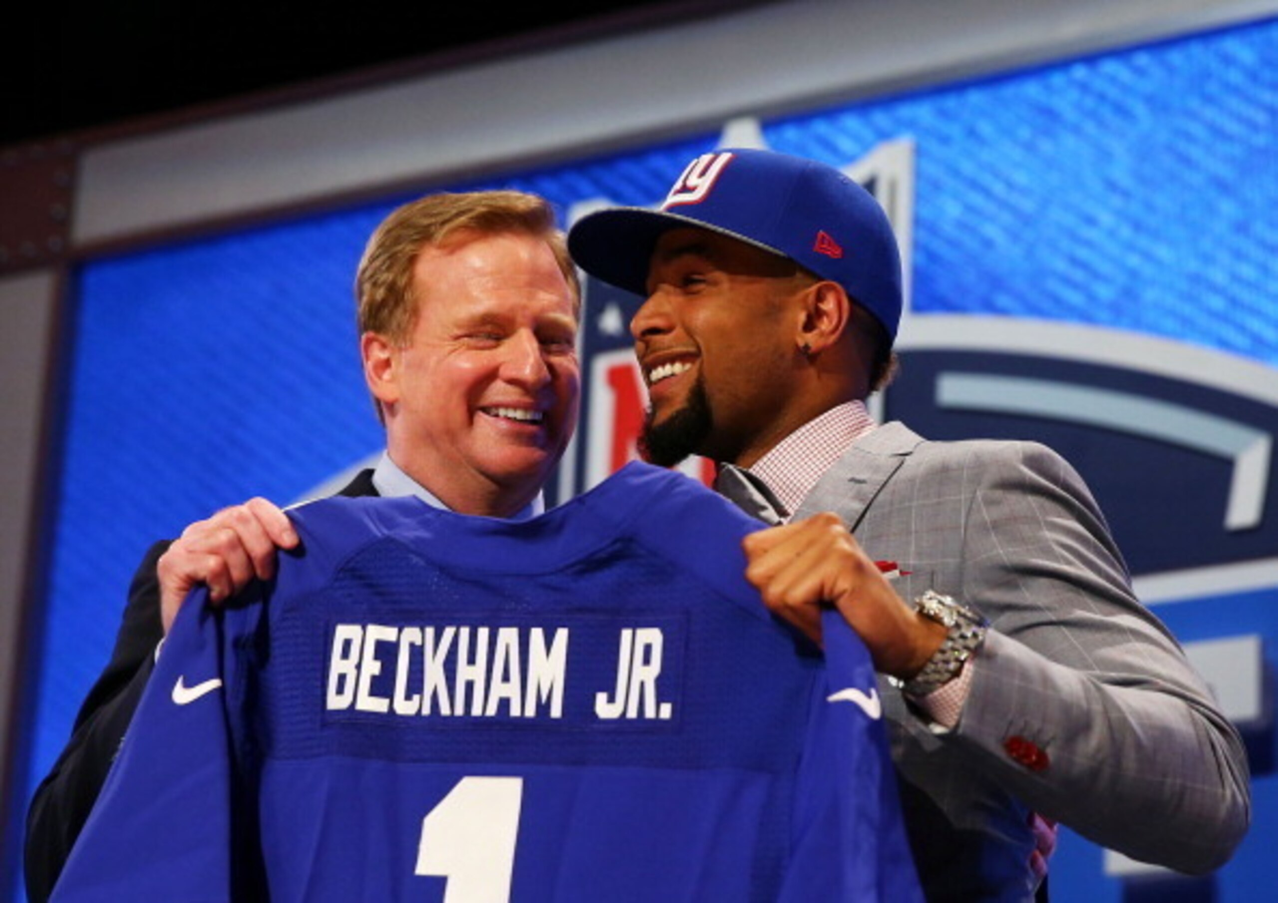 NEW YORK, NY - MAY 08:  Odell Beckham Jr of the LSU Tigers poses with NFL Commissioner Roger Goodell after he was picked #12 overall by the New York Giants during the first round of the 2014 NFL Draft at Radio City Music Hall on May 8, 2014 in New York Ci