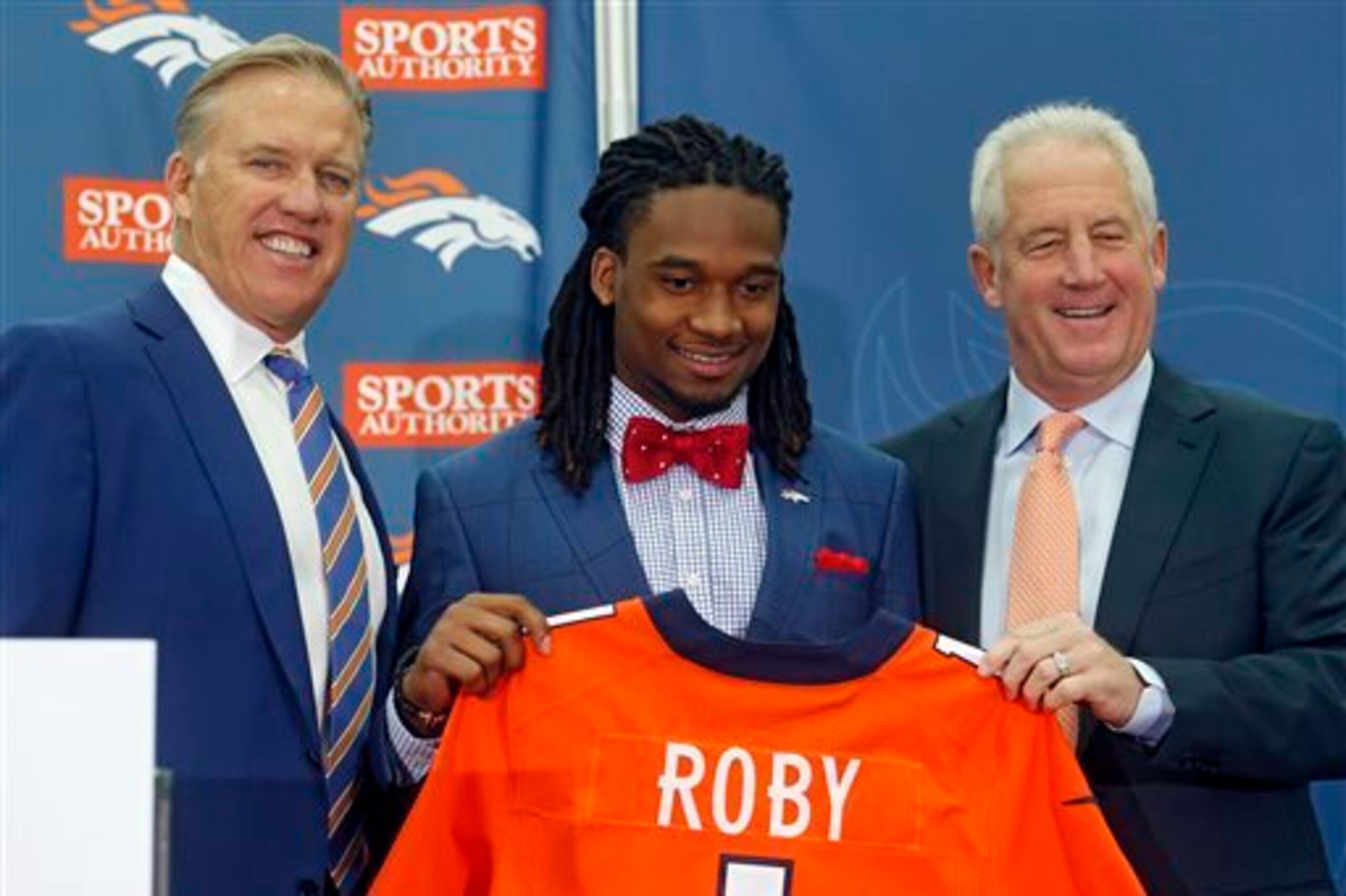 GM John Elway (left) and HC John Fox (right) welcome first-round pick Bradley Roby.