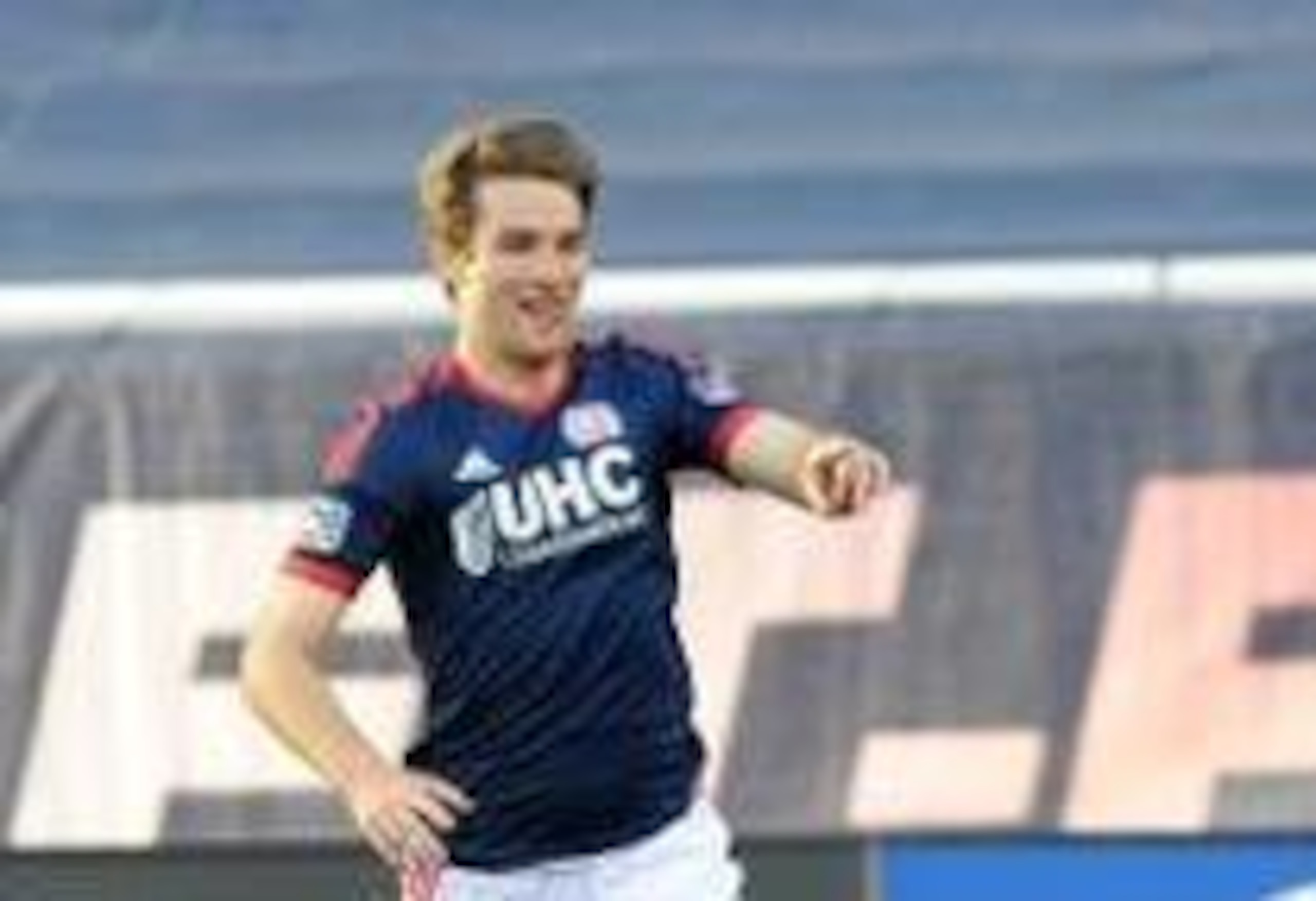 May 11, 2014; Foxborough, MA, USA; New England Revolution forward Patrick Mullins (7) reacts after scoring a goal during the first half against the Seattle Sounders FC at Gillette Stadium. Mandatory Credit: Bob DeChiara-USA TODAY Sports