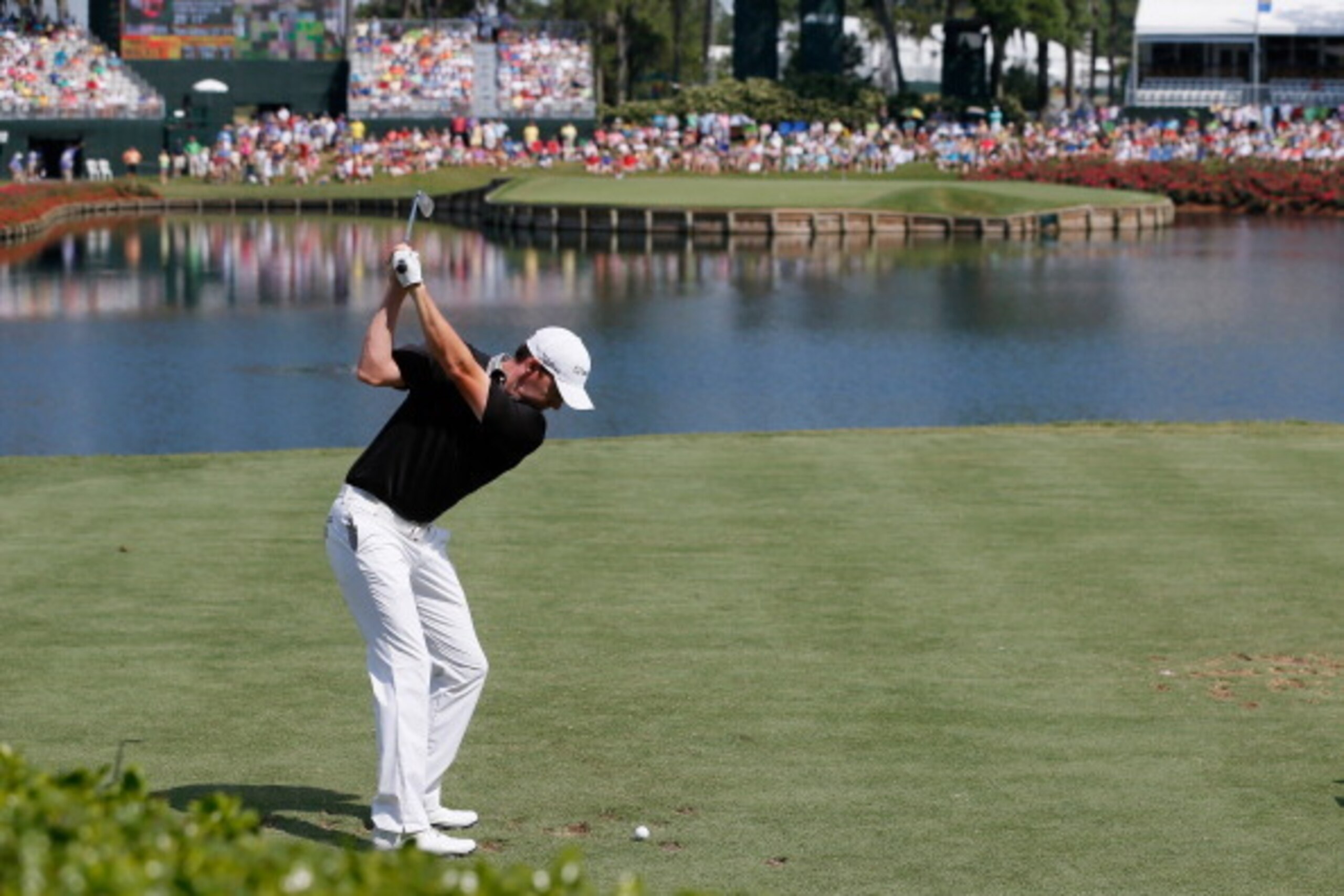 Jimmy Walker takes on the island green 17th at the Players Championship.