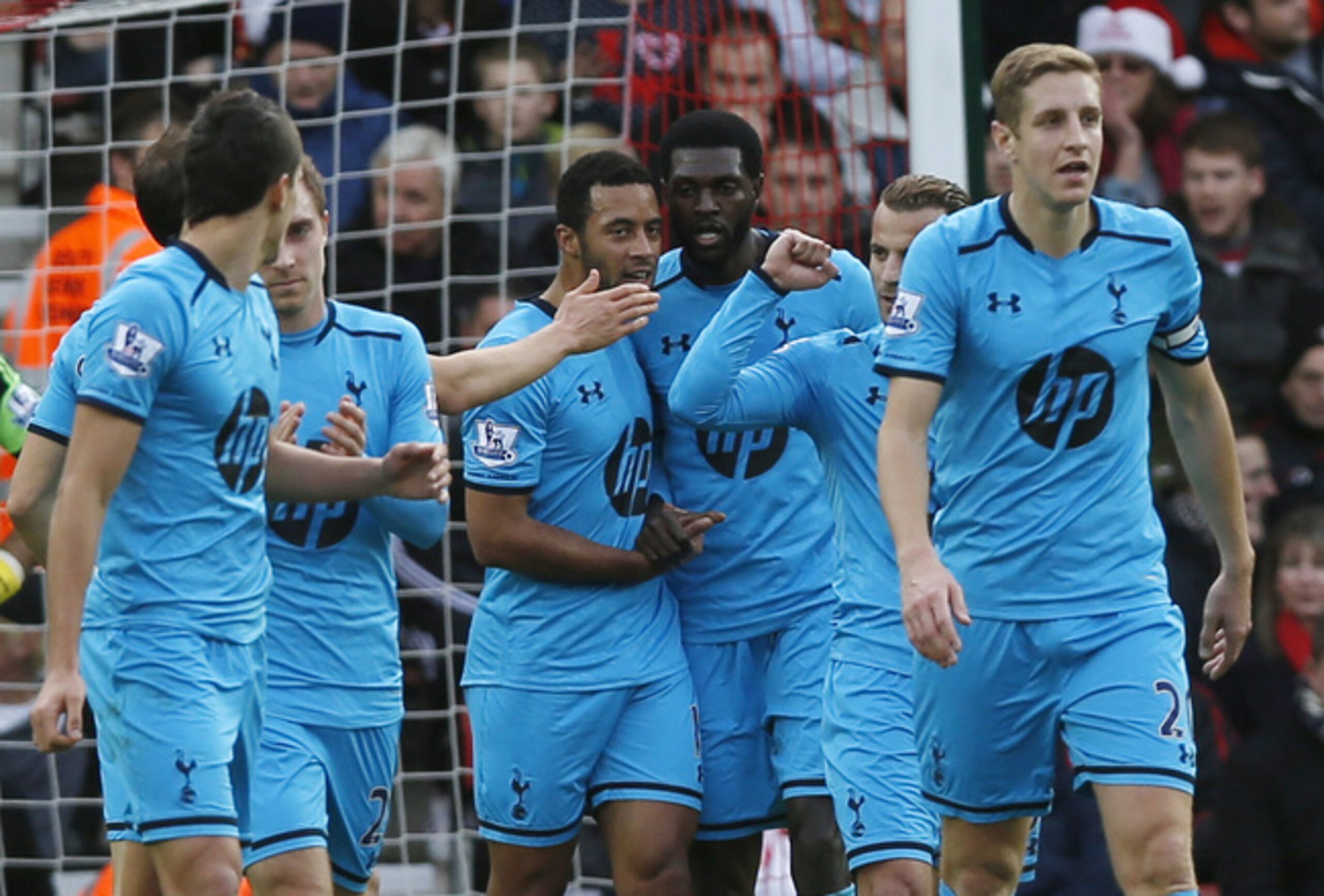Adebayor and his Spurs team-mates celebrate after equalising at Southampton on the counter-attack.