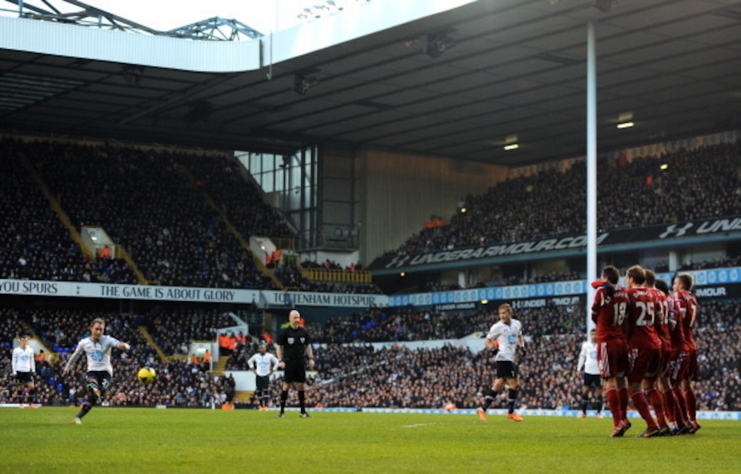 Christian Eriksen lets fly with the free-kick which would be his first Premier League goal.