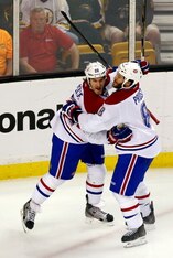 Dale Weise (left) celebrates his first-period goal in Game 7.