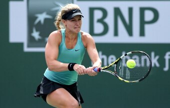 Eugunie Bouchard hits a shot against Simona Halep at Indian Wells.