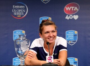 NEW HAVEN, CT - AUGUST 24:  Simona Halep of Romania answers questions during a press conference after the Women's Final on Day Seven of the New Haven Open at Yale at the Connecticut Tennis Center on August 24, 2013 in New Haven, Connecticut. Halep defeate
