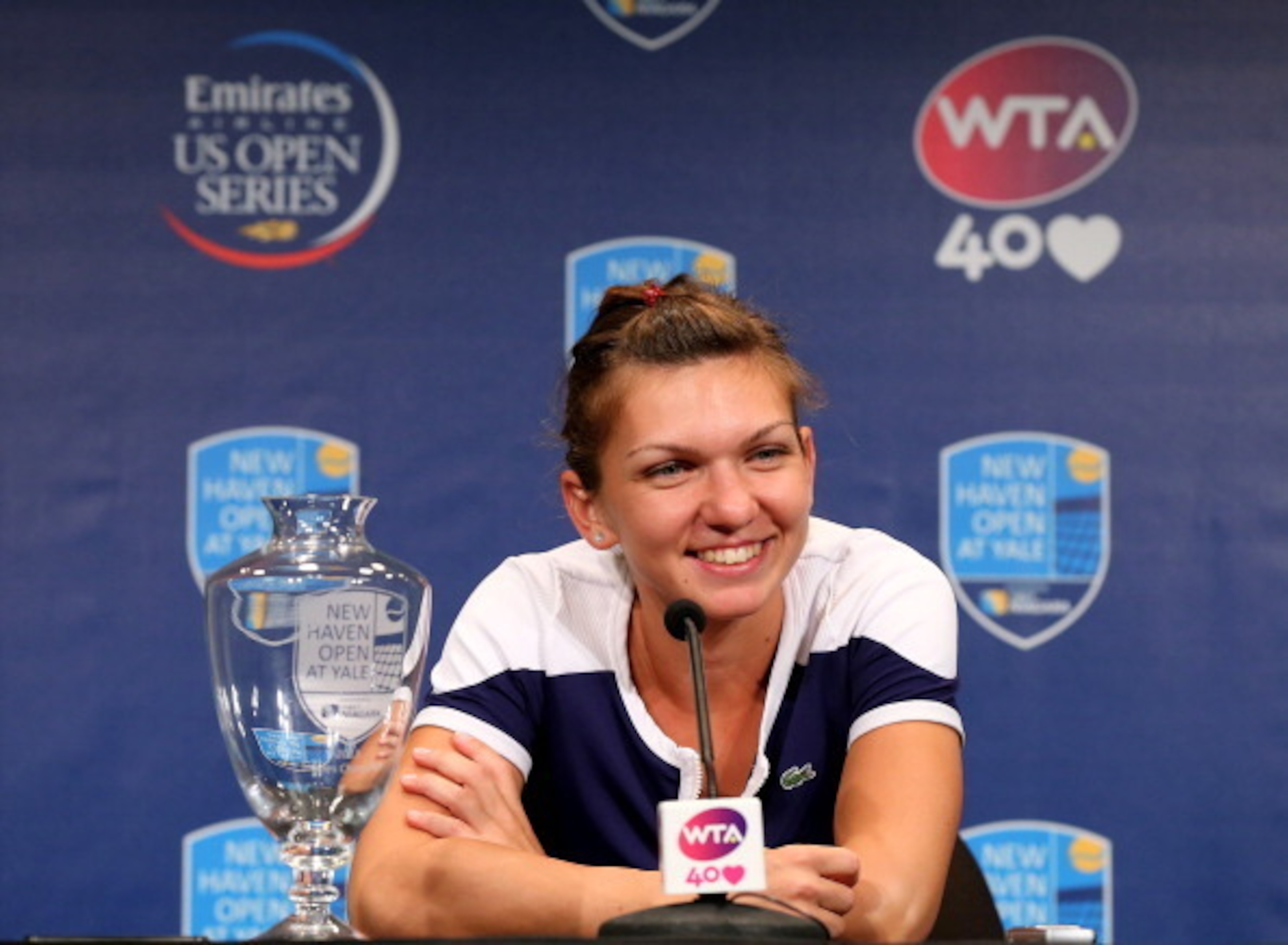 NEW HAVEN, CT - AUGUST 24:  Simona Halep of Romania answers questions during a press conference after the Women's Final on Day Seven of the New Haven Open at Yale at the Connecticut Tennis Center on August 24, 2013 in New Haven, Connecticut. Halep defeate