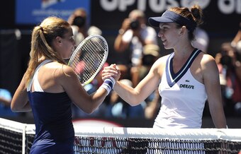 Dominika Cibulkova shakes hands with Simona Halep at 2014 Australian Open