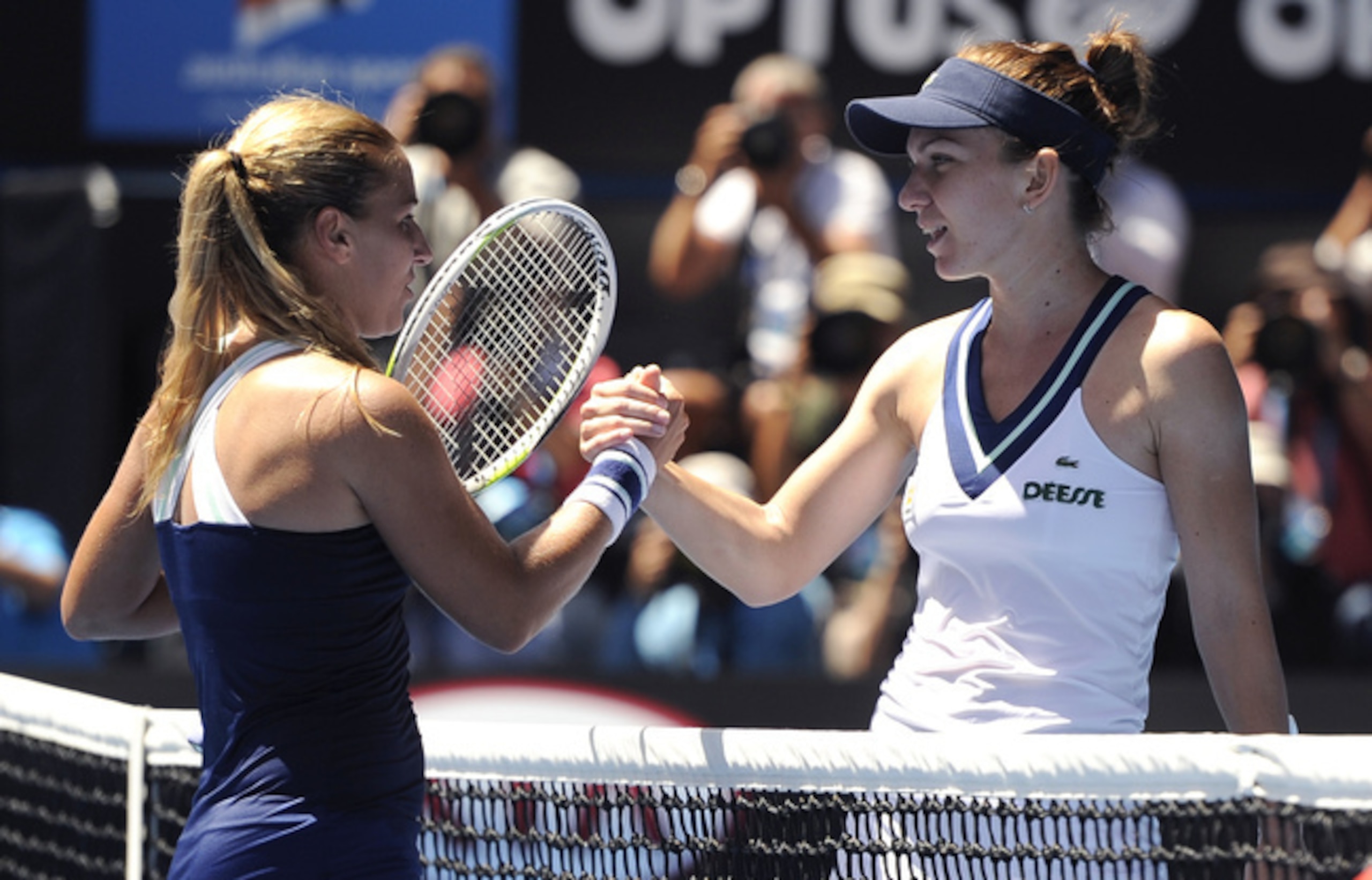 Dominika Cibulkova shakes hands with Simona Halep at 2014 Australian Open