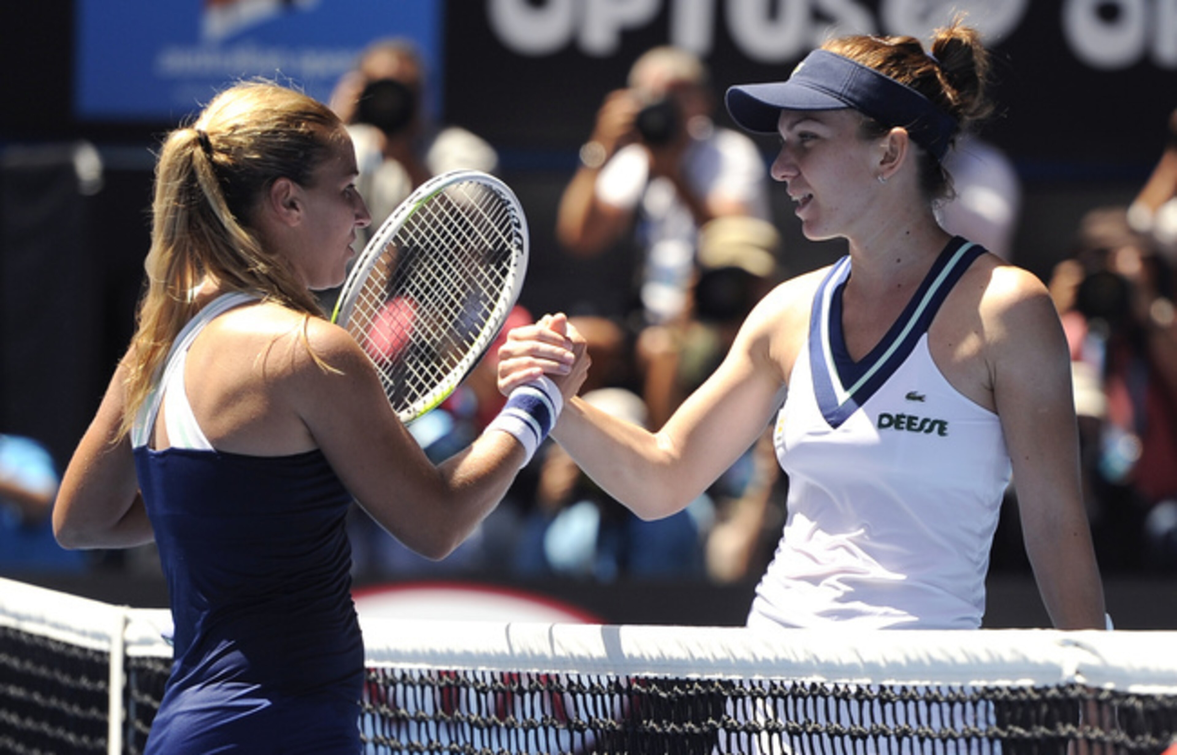 Dominika Cibulkova shakes hands with Simona Halep at 2014 Australian Open