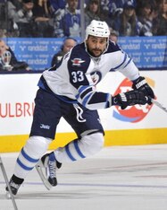 Dustin Byfuglien would add a physical element to the Ducks' defense.