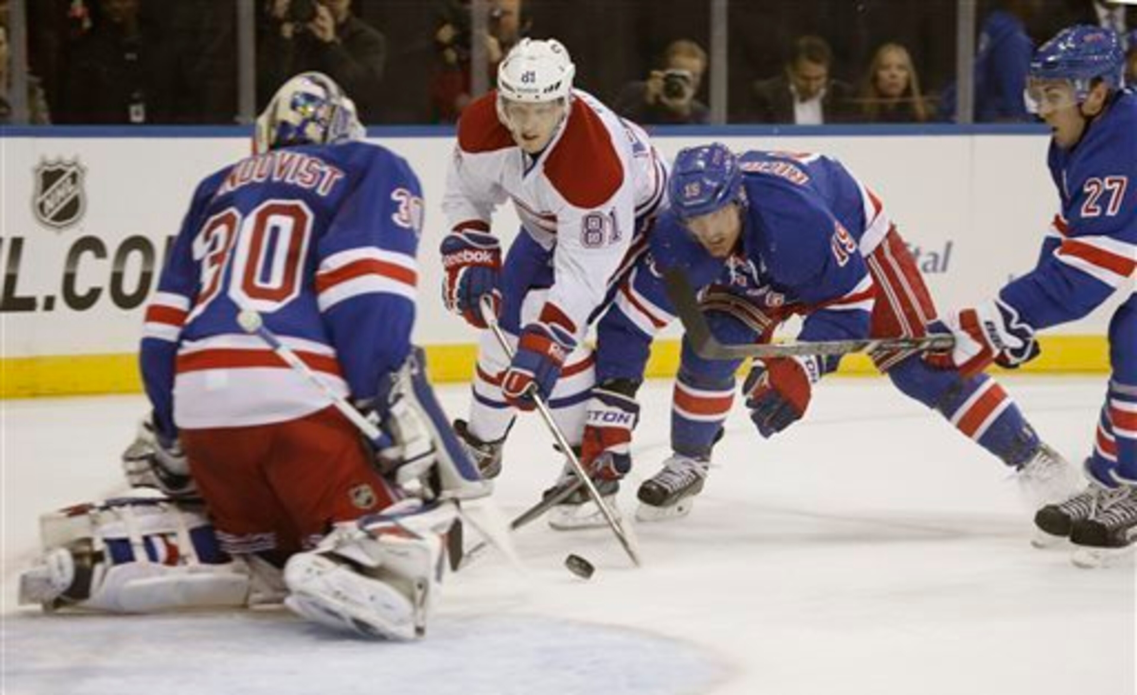 Montreal Canadiens forward Lars Eller moves in on New York Rangers goalie Henrik Lundqvist as Brad Richards and Ryan McDonagh look on. Montreal Canadiens forward Lars Eller moves in on New York Rangers goalie Henrik Lundqvist as Brad Richards and Ryan McDonagh look on.