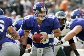 Manning became the first quarterback in history to throw a game-winning touchdown pass  on the same day he takes eight sacks.