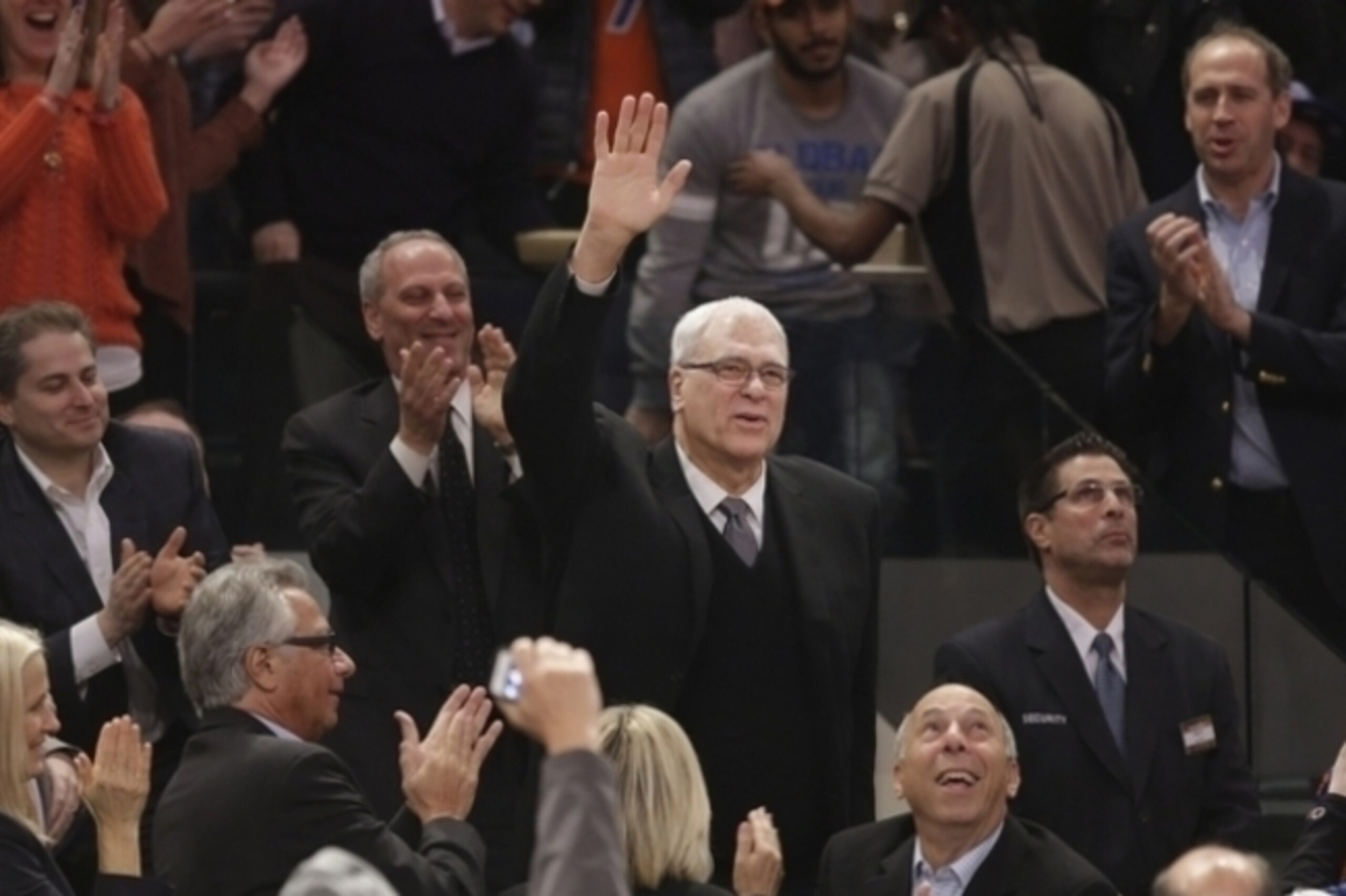 Phil Jackson waves to adoring Knicks fans during the Knicks' victory over the Pacers in March. (Or maybe he's raising his hand to volunteer for the head coach job.)