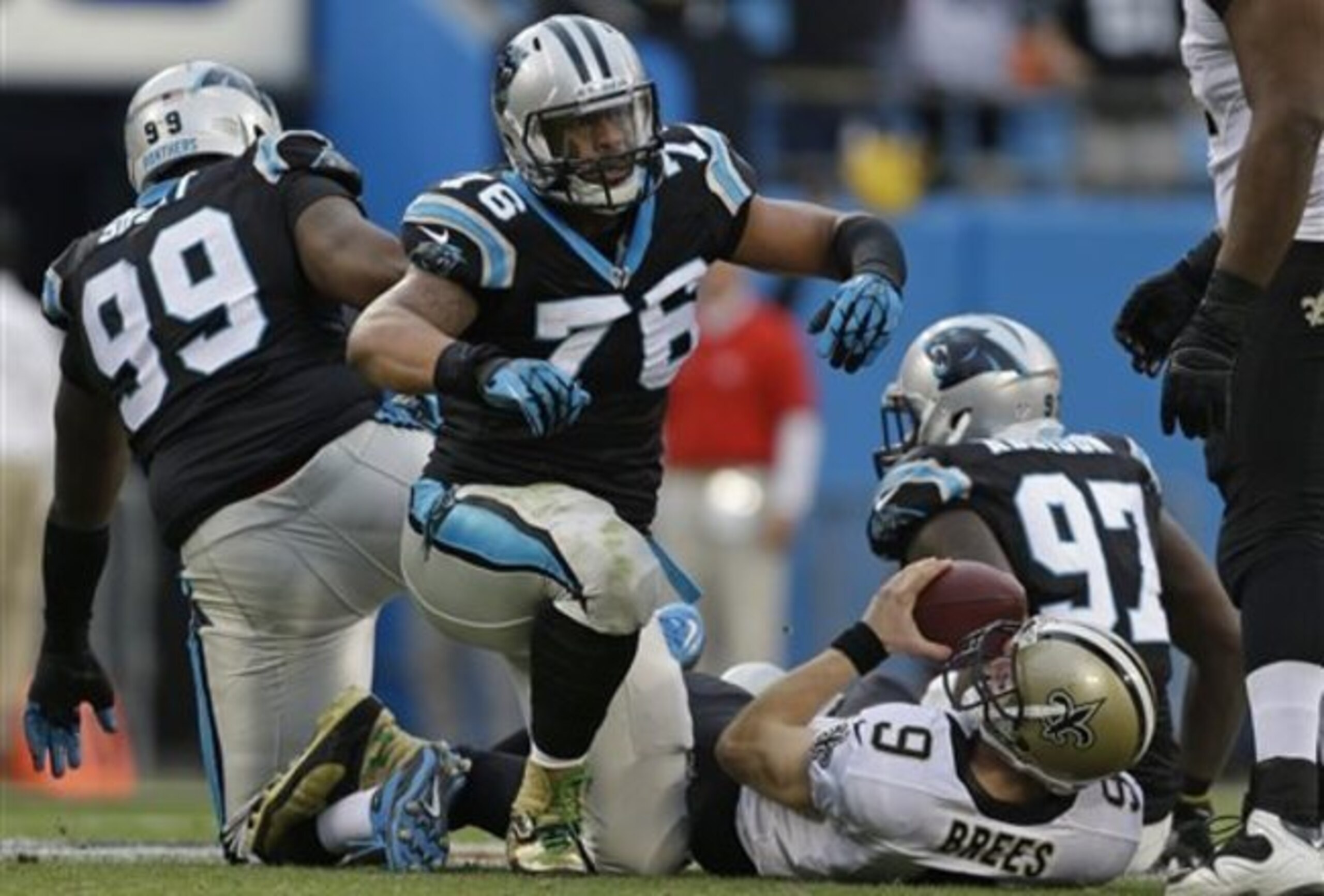 Pro-Bowl end Greg Hardy (middle) and 2013 rookie tackle Kawann Short (left)