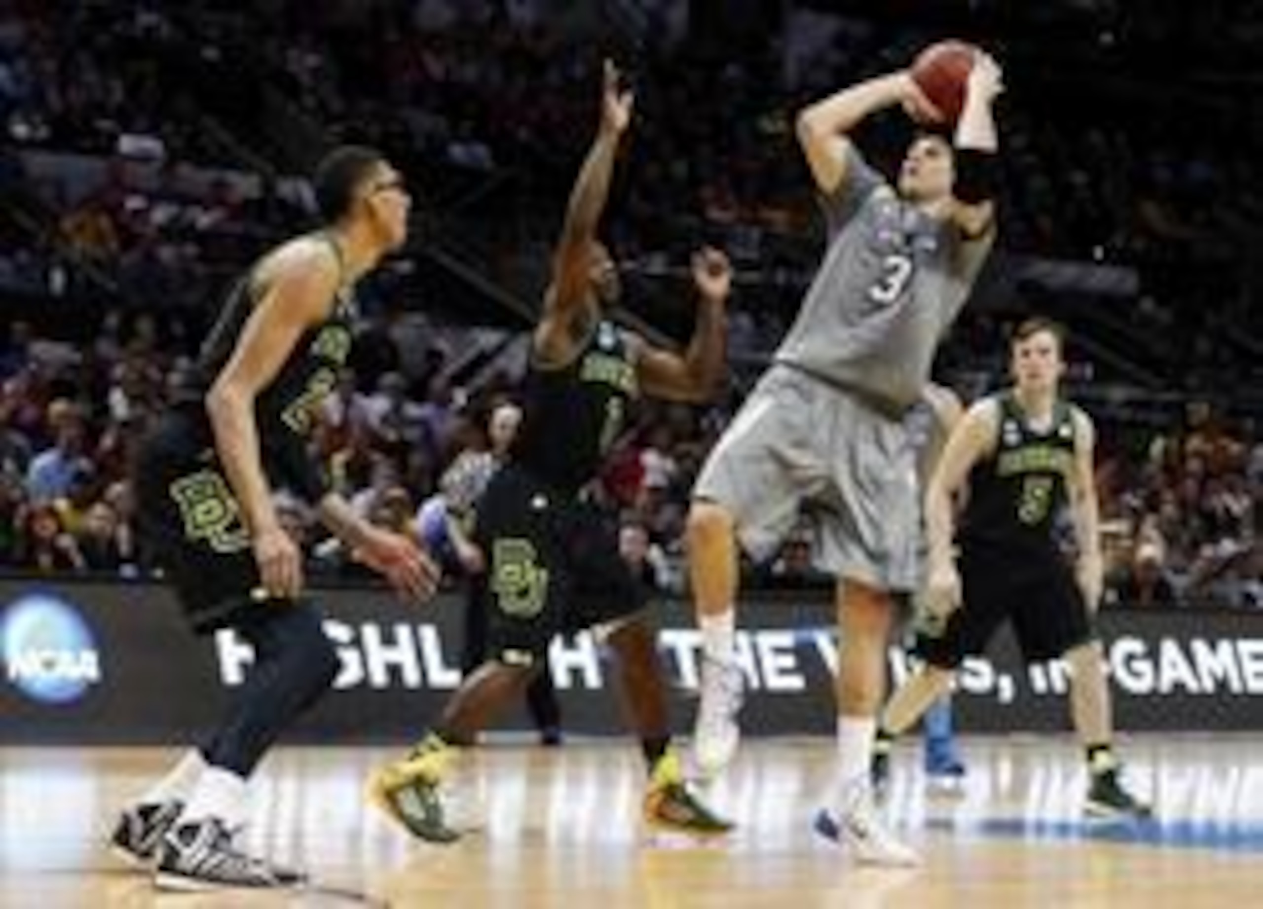 McDermott hoisting a shot against Baylor.
