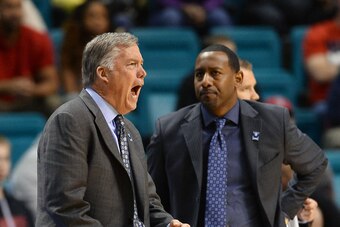 Former California assistant Travis DeCuire (right)