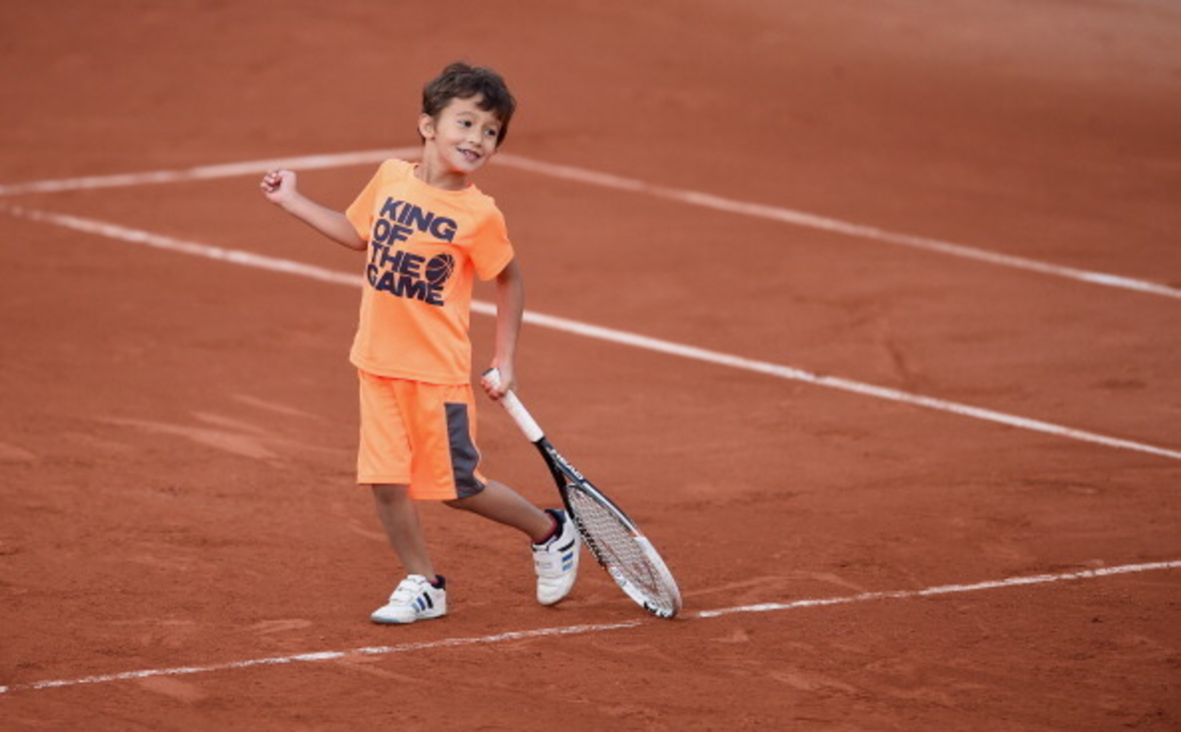 Leon Zimonjic plays on clay courts at Roland Garros following his father's doubles match.