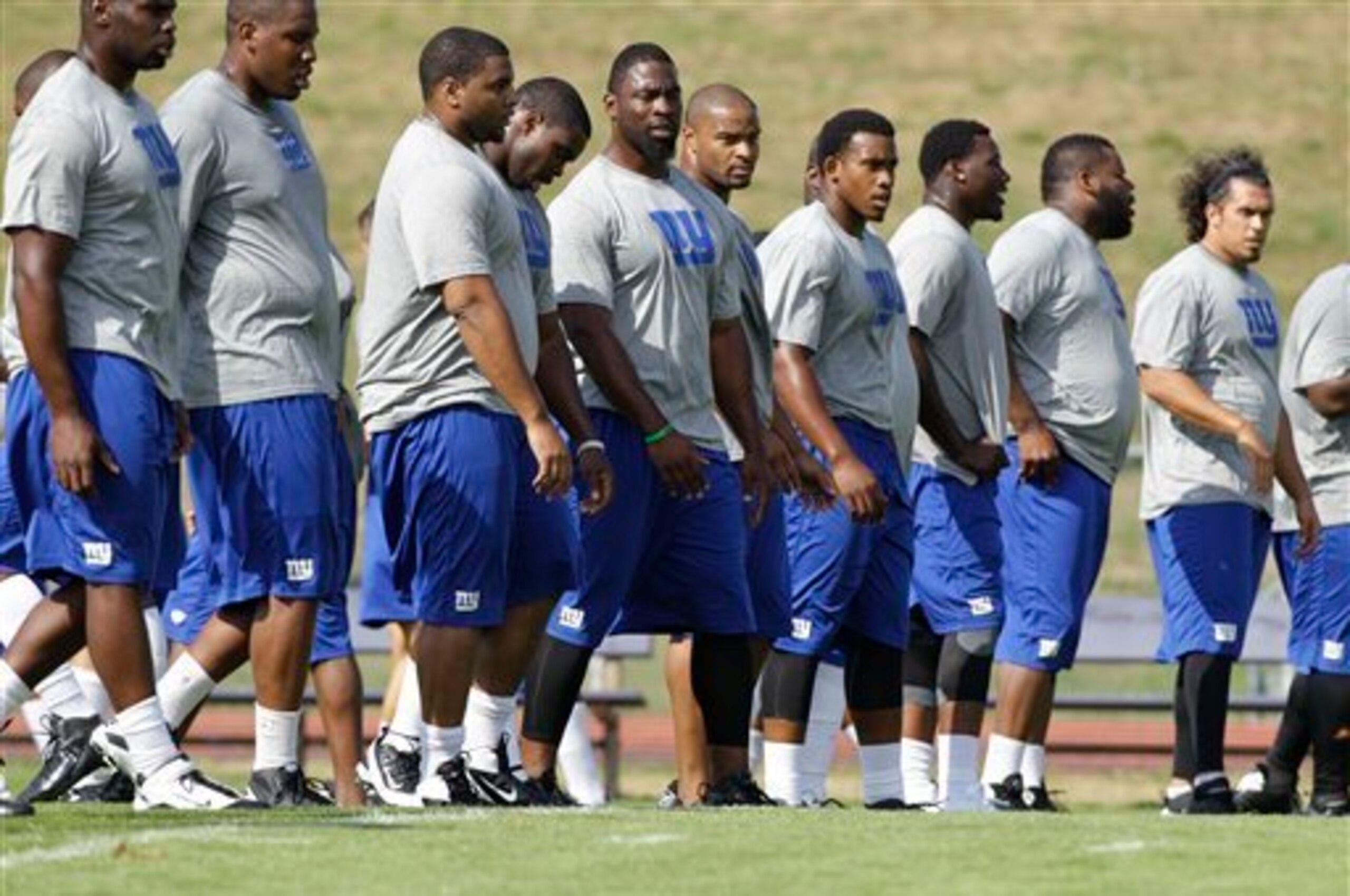 Longtime defensive end Justin Tuck (center) signed with the Oakland Raiders this offseason.