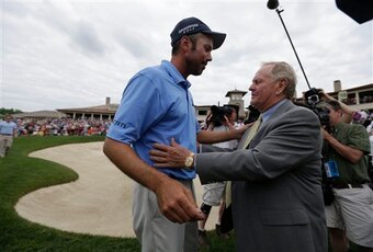 2013 Memorial winner Matt Kuchar receives congratulations from Jack Nicklaus.