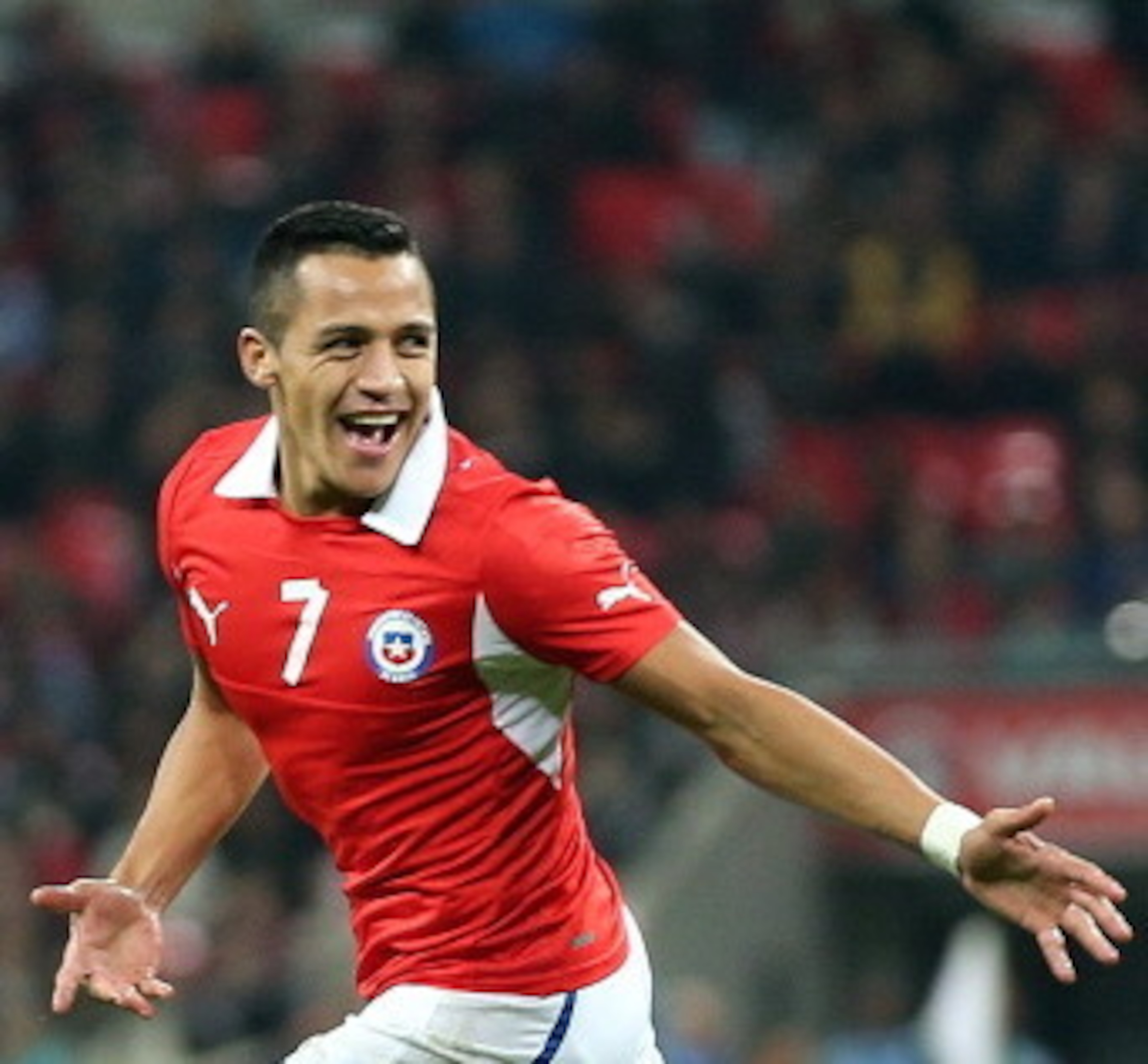 LONDON, ENGLAND - NOVEMBER 15:  Alexis Sanchez of Chile celebrates after scoring the opening goal during the international friendly match between England and Chile at Wembley Stadium on November 15, 2013 in London, England.  (Photo by Clive Brunskill/Gett