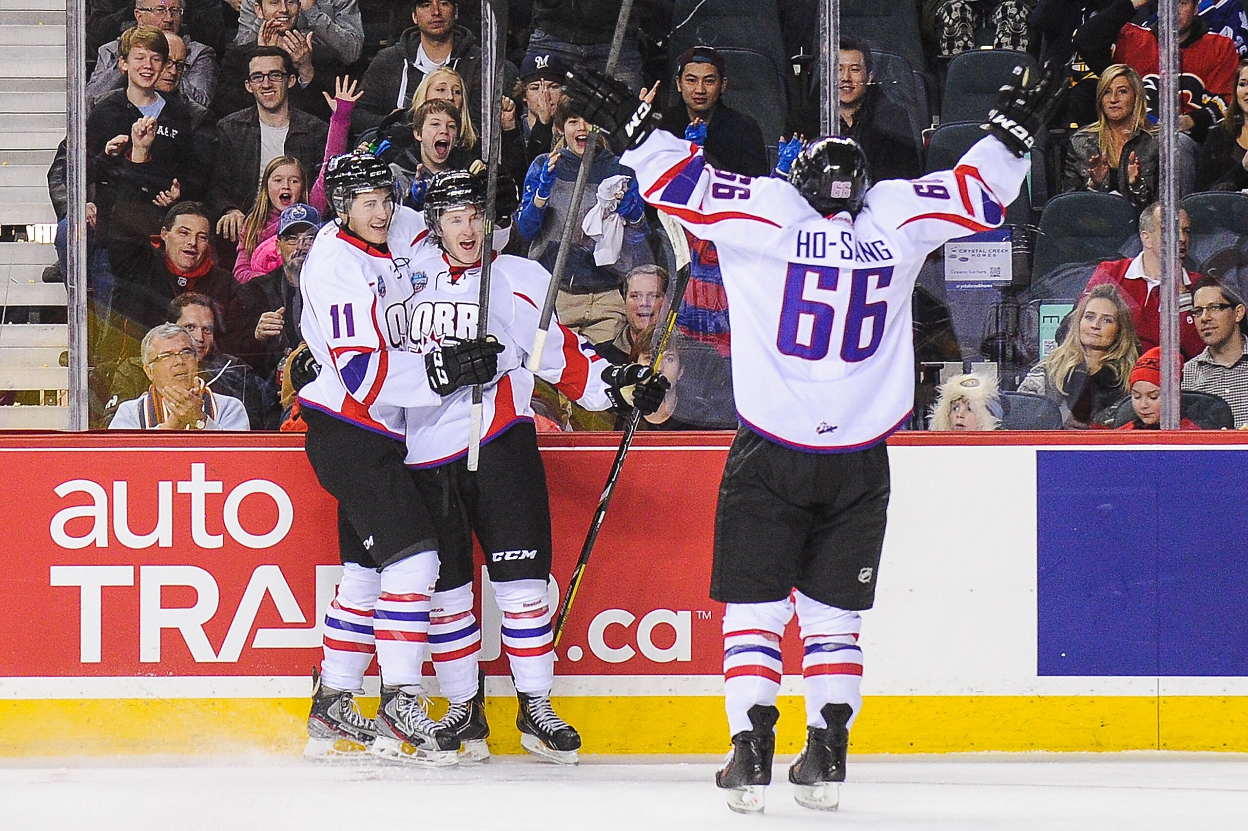 Perlini (No. 11, far left) celebrates with fellow teammates at the CHL Top Prospects game in January.