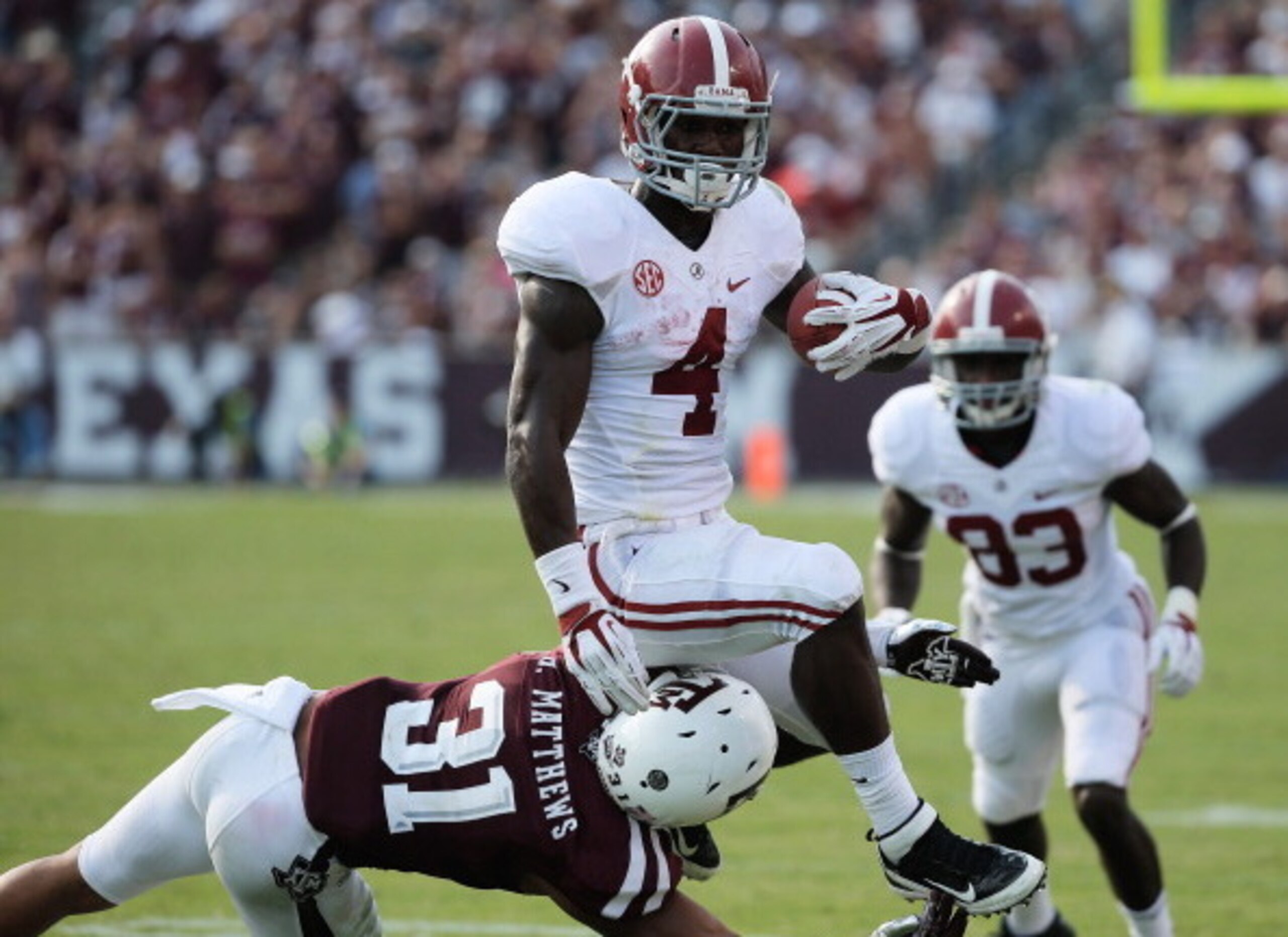 COLLEGE STATION, TX - SEPTEMBER 14:  T.J. Yeldon #4 of the  Alabama Crimson Tide runs against Howard Matthews #31 of Texas A&M Aggies during the game at Kyle Field on September 14, 2013 in College Station, Texas.  (Photo by Scott Halleran/Getty Images)