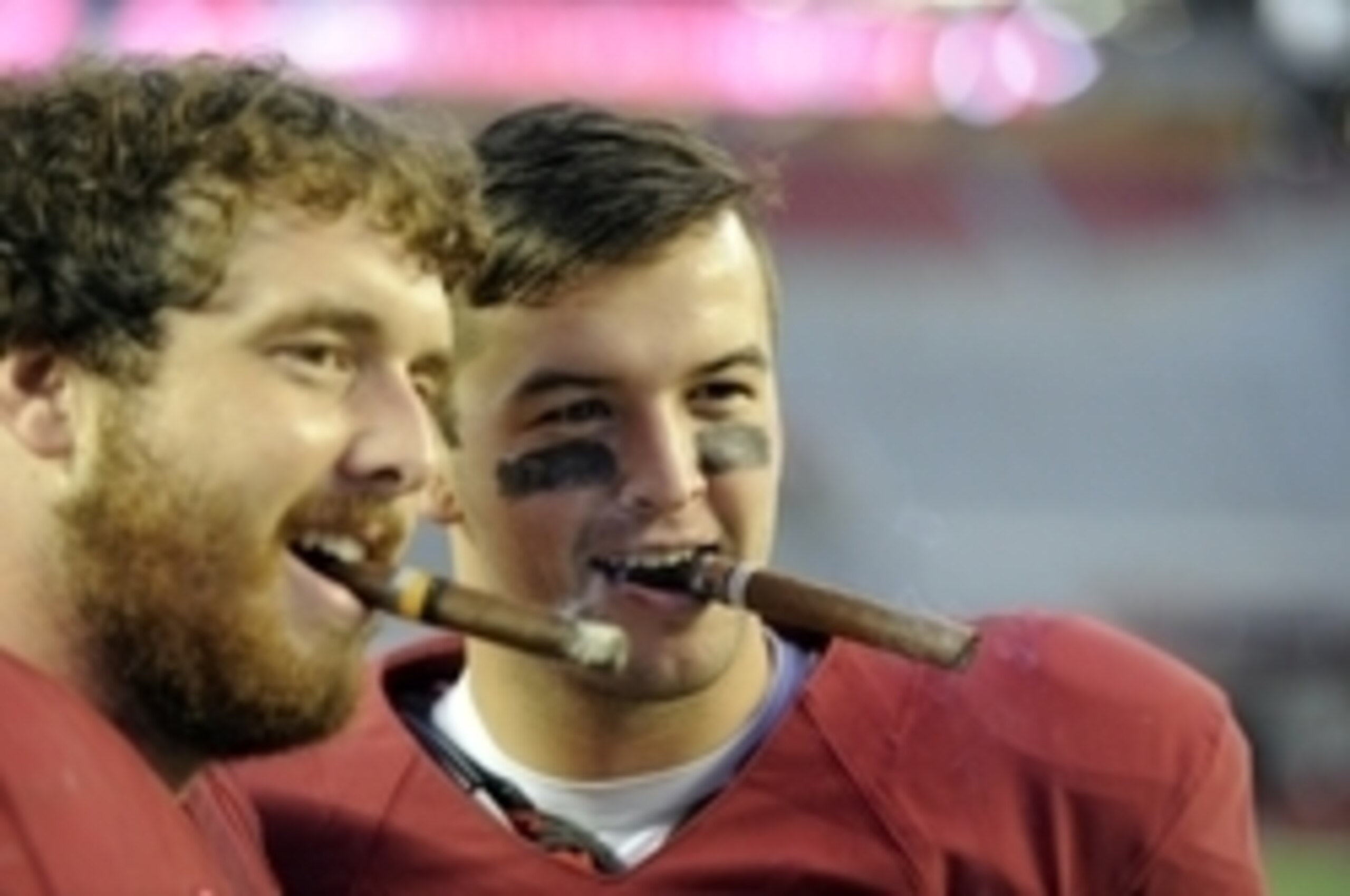 Oct 26, 2013; Tuscaloosa, AL, USA; Alabama Crimson Tide quarterback A.J. McCarron (10) smoke a cigar with offensive linesman Anthony Steen (61) following their 45-10 victory over the Tennessee Volunteers at Bryant-Denny Stadium. Mandatory Credit: John Dav