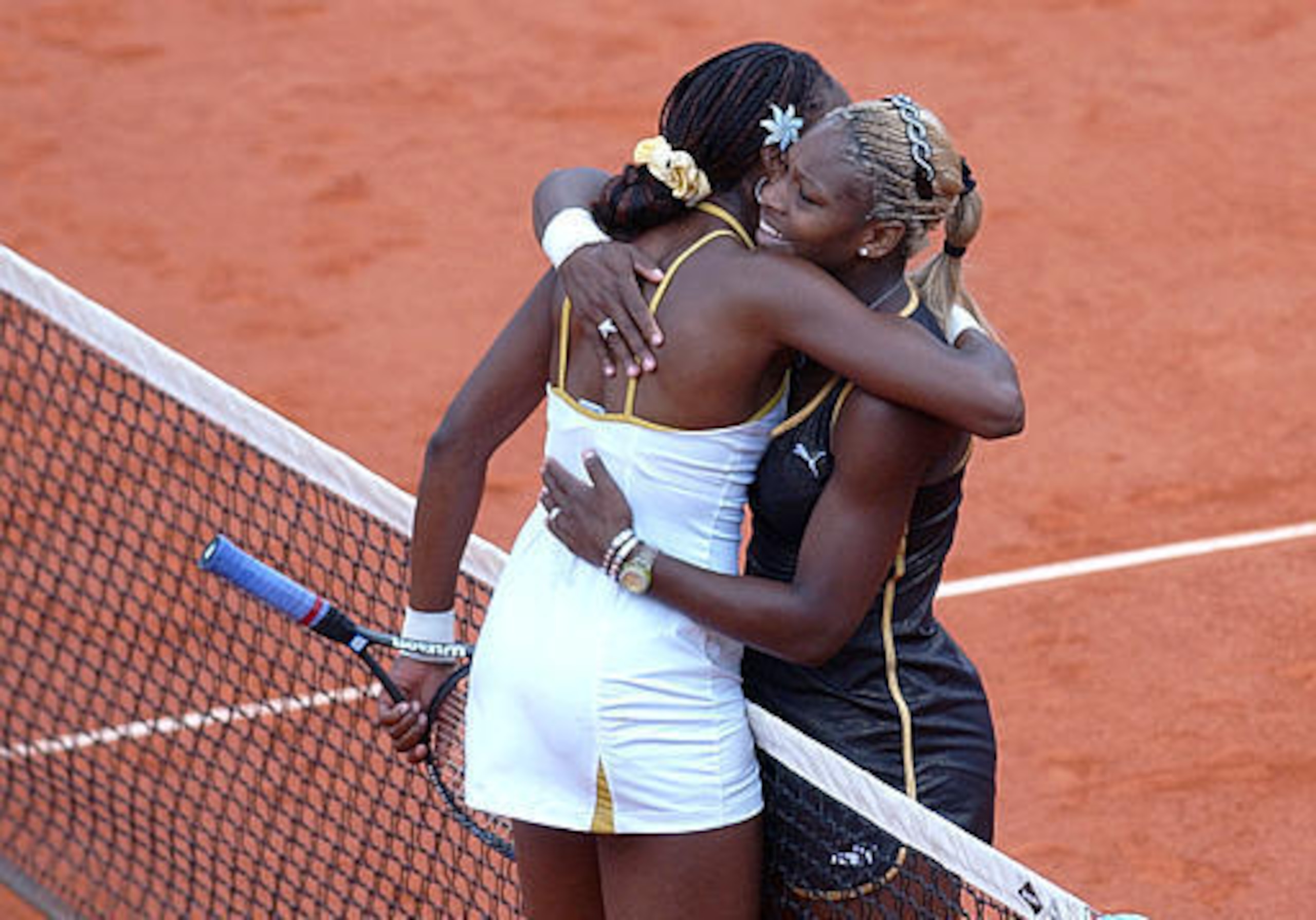 Venus Williams hugs sister Serena after 2002 French Open finals Venus Williams hugs sister Serena after 2002 French Open finals