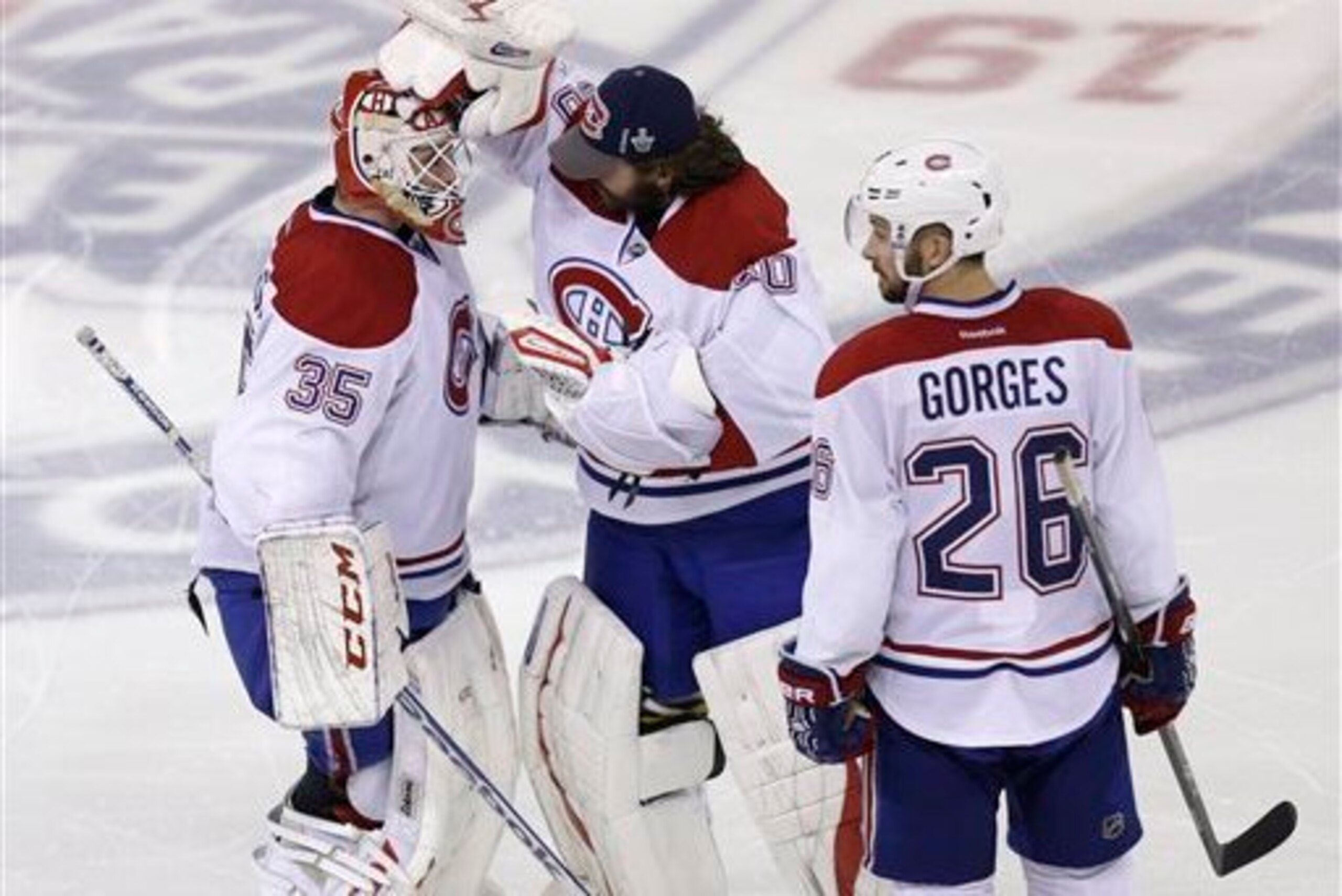 Montreal Canadiens goaltenders (from left) Dustin Tokarski, Peter Budaj and defenseman Josh Gorges. Montreal Canadiens goaltenders (from left) Dustin Tokarski, Peter Budaj and defenseman Josh Gorges.