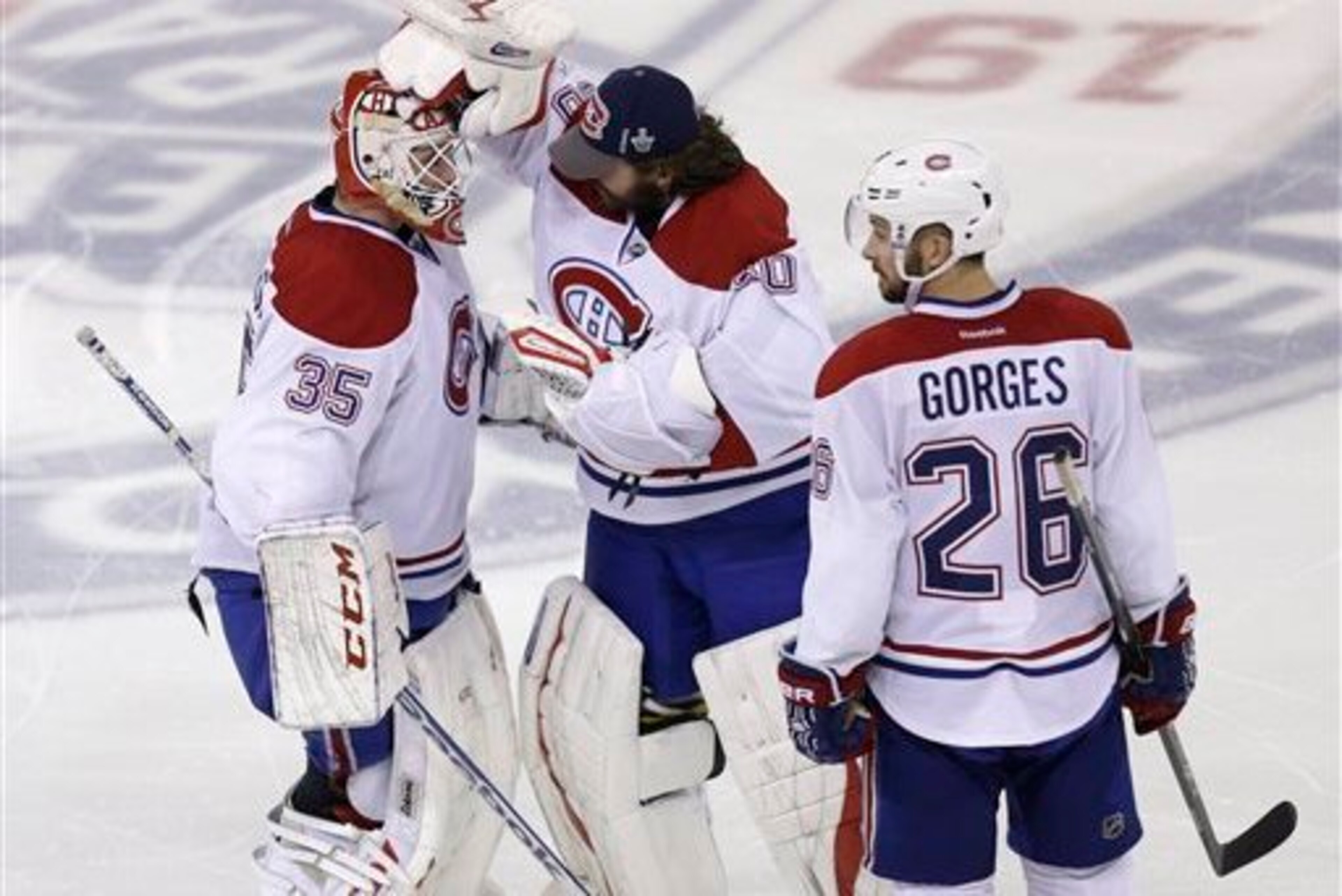 Montreal Canadiens goaltenders (from left) Dustin Tokarski, Peter Budaj and defenseman Josh Gorges.