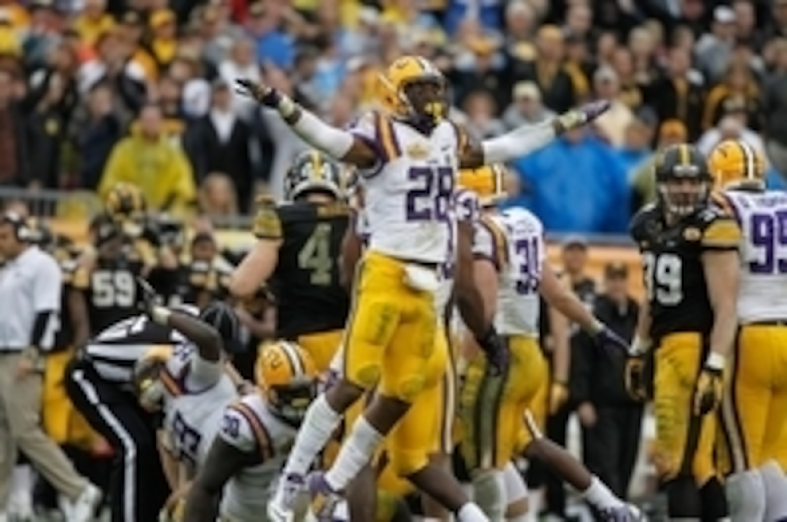 LSU safety Jalen Mills celebrates against Iowa in the 2014 Outback Bowl.