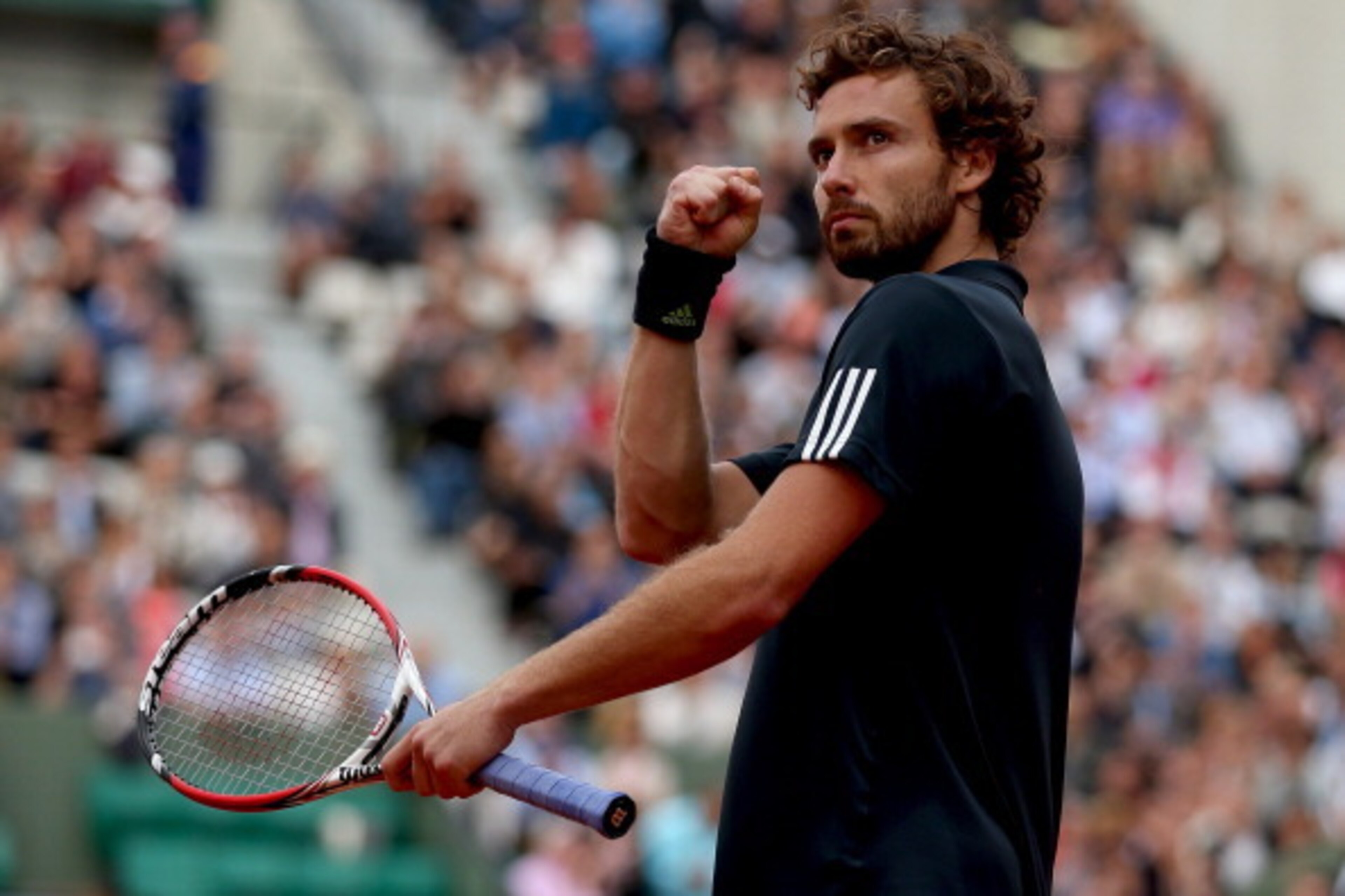 Ernest Gulbis gestures during his match against Tomas Berdych in the quarterfinals of the French Open.
