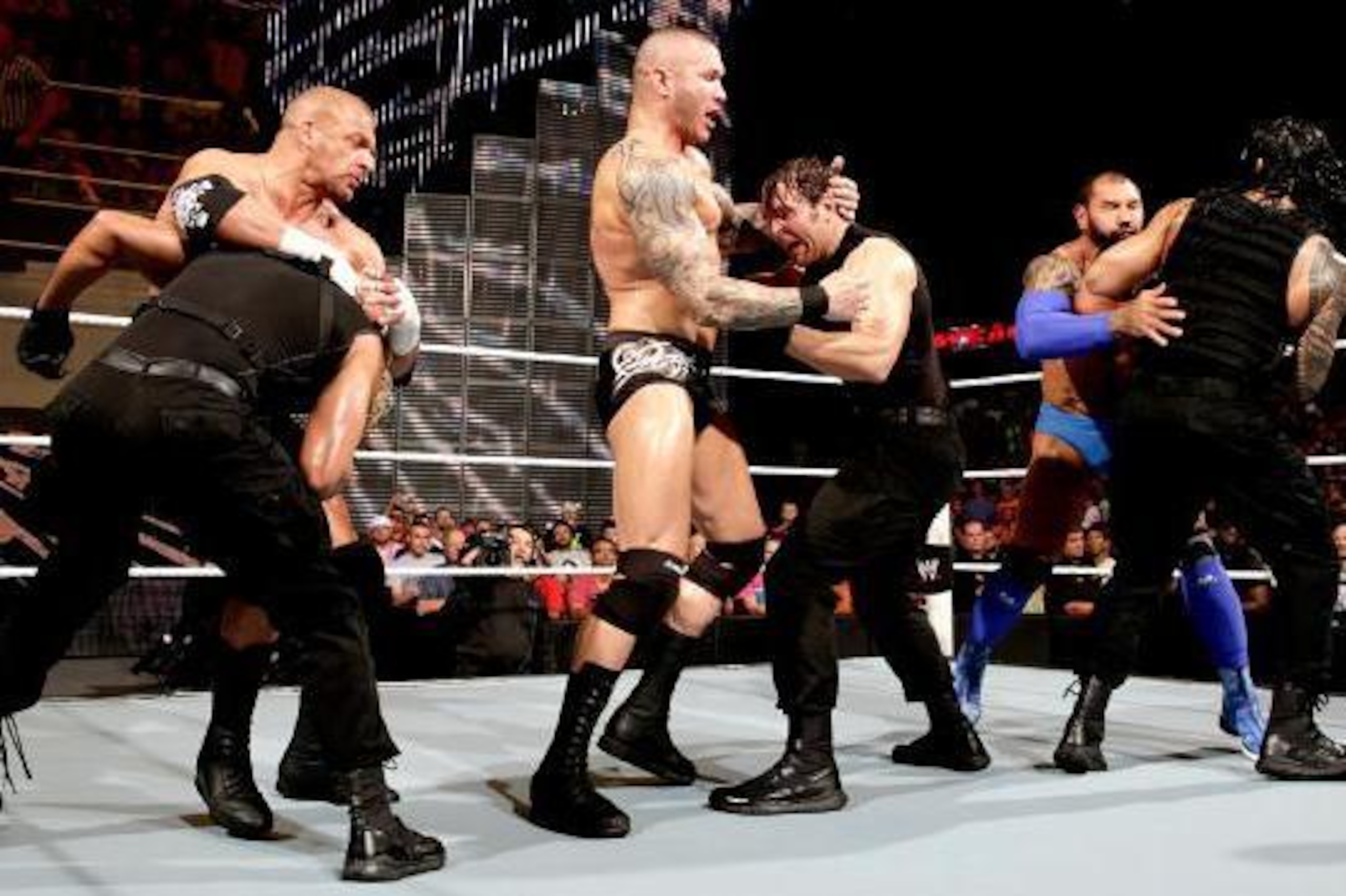 The scheduled match between Evolution and The Shield explodes into a frenzy.