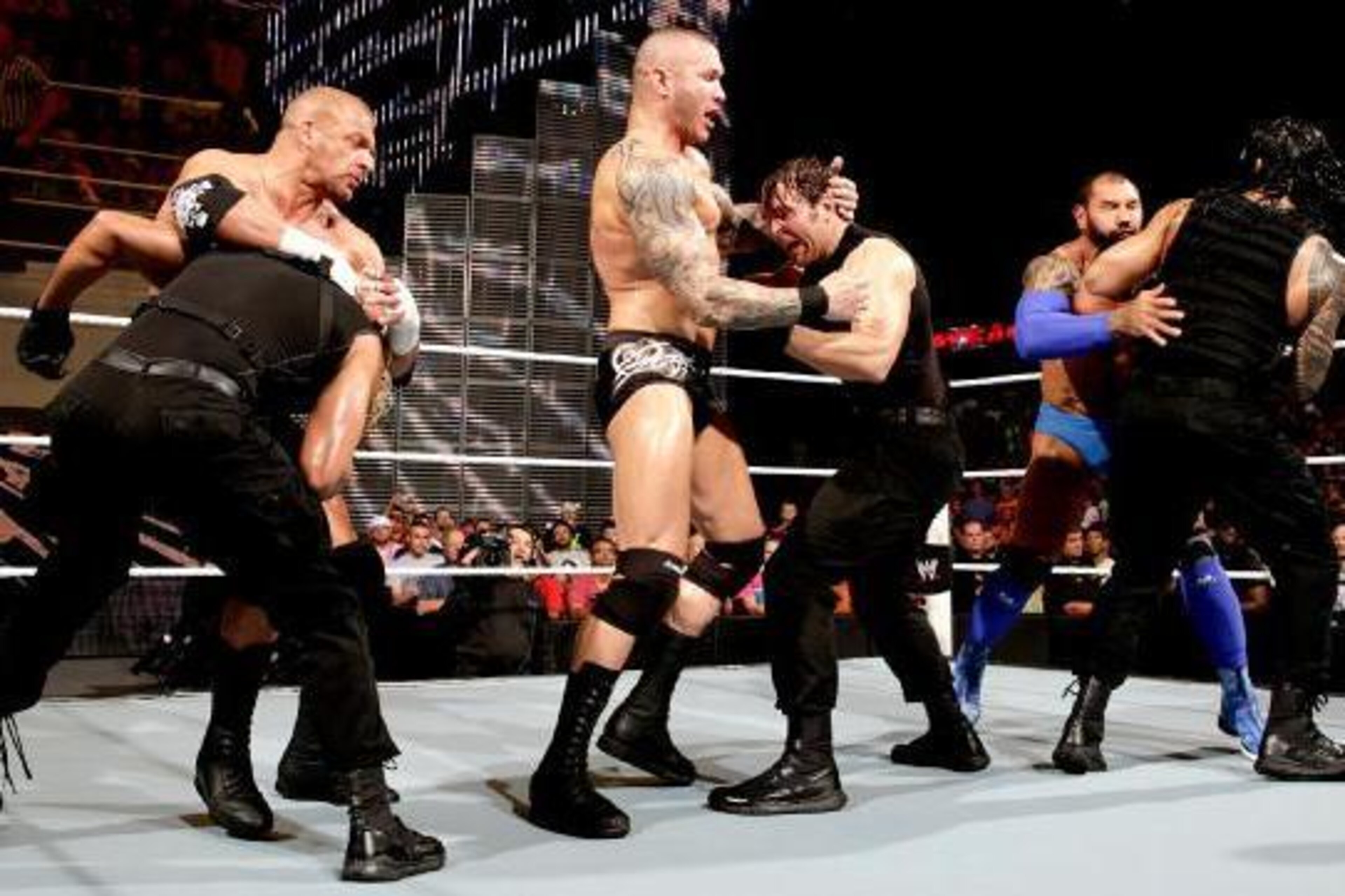 The scheduled match between Evolution and The Shield explodes into a frenzy.