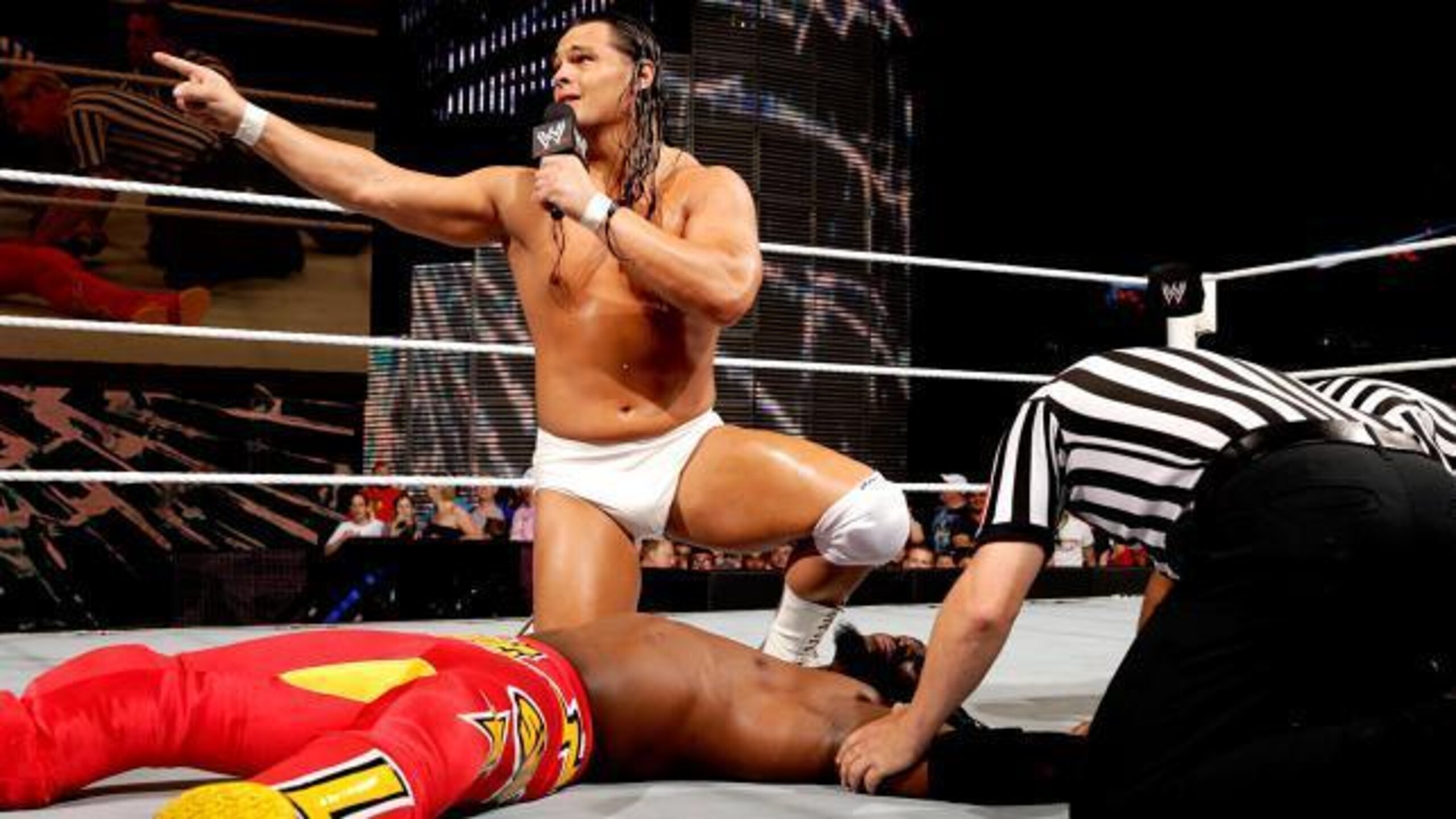 Bo Dallas gives Kofi Kingston a pep talk after an ambush from Kane.