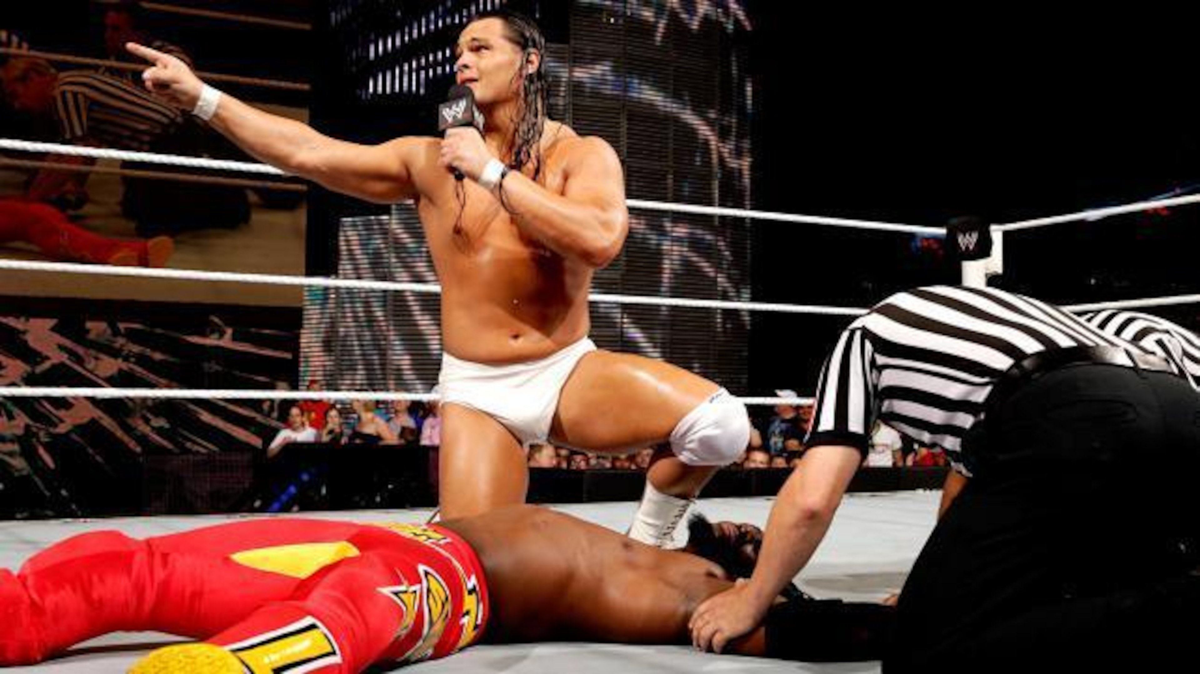 Bo Dallas gives Kofi Kingston a pep talk after an ambush from Kane.