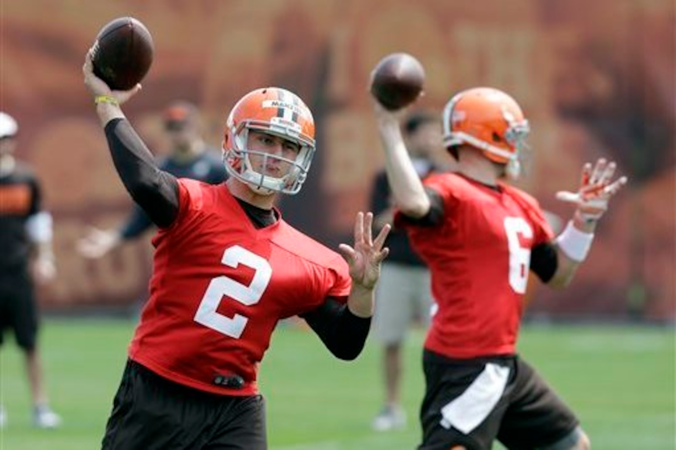 Johnny Manziel (2) and Brian Hoyer (6) are battling for the Cleveland Browns' starting quarterback job.
