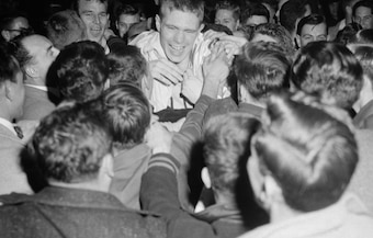 Heinsohn mobbed by fans after Game 7 victory.