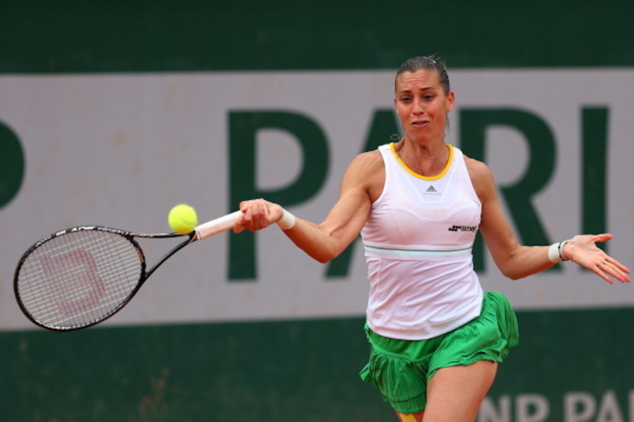 Flavia Pennetta hits a forehand during a match at the 2014 French Open. Flavia Pennetta hits a forehand during a match at the 2014 French Open.