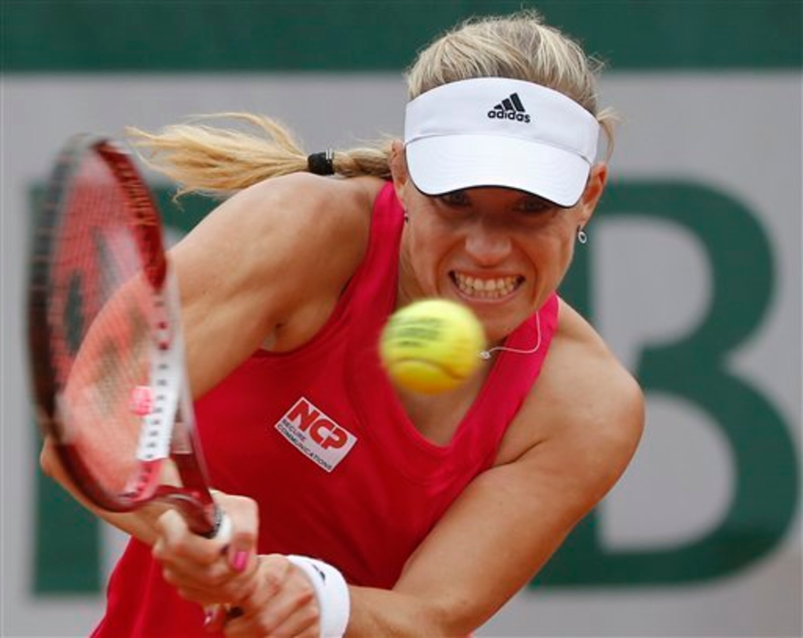 Angelique Kerber attacks the ball during a match at 2014 French Open. Angelique Kerber attacks the ball during a match at 2014 French Open.